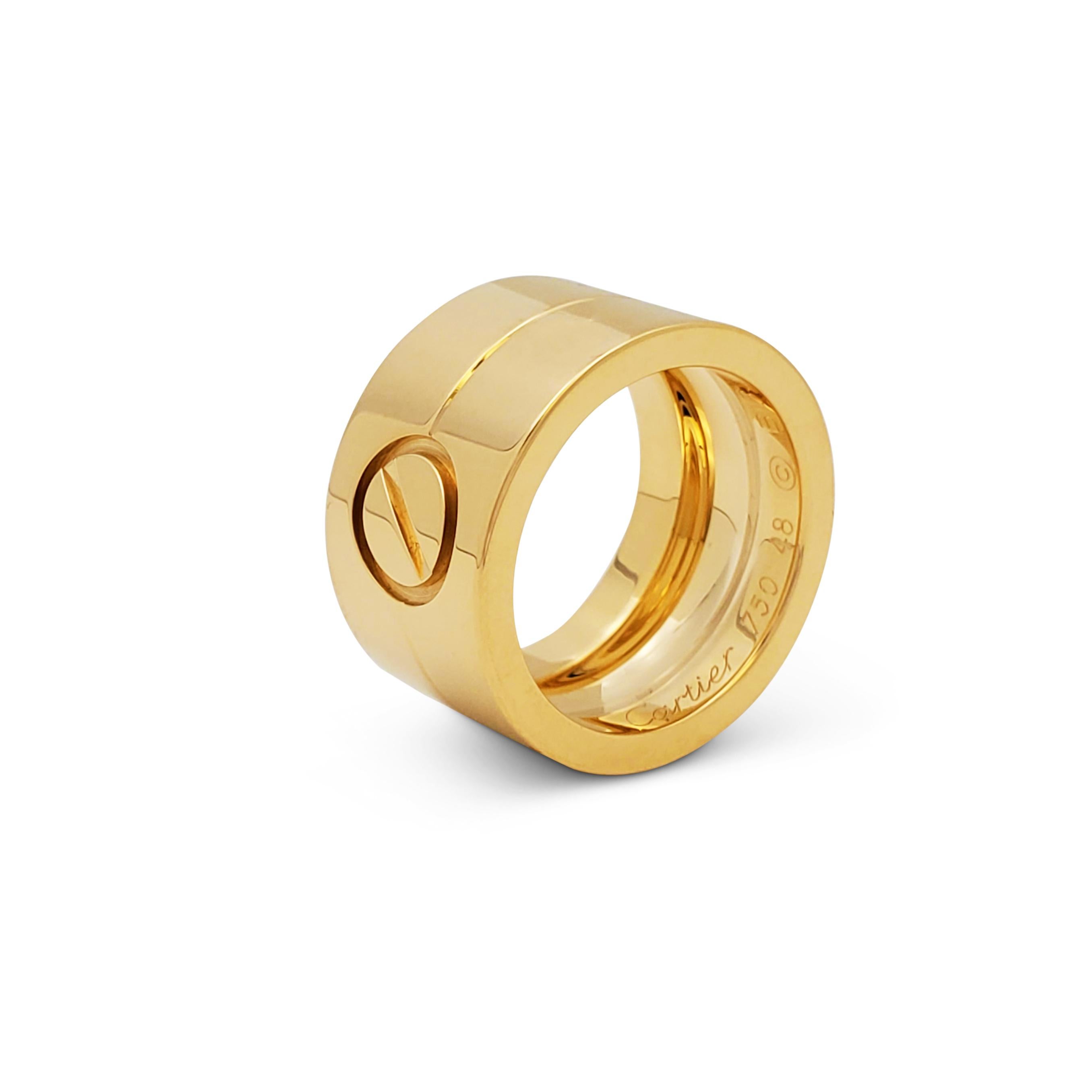 Authentic Cartier Love ring crafted in 18 karat yellow gold and featuring the brand's iconic screwtop design, represented here as a single motif.  Size 48, US 4 1/2.  Signed Cartier 750, 48, with serial number.  Ring is accompanied by Cartier pouch