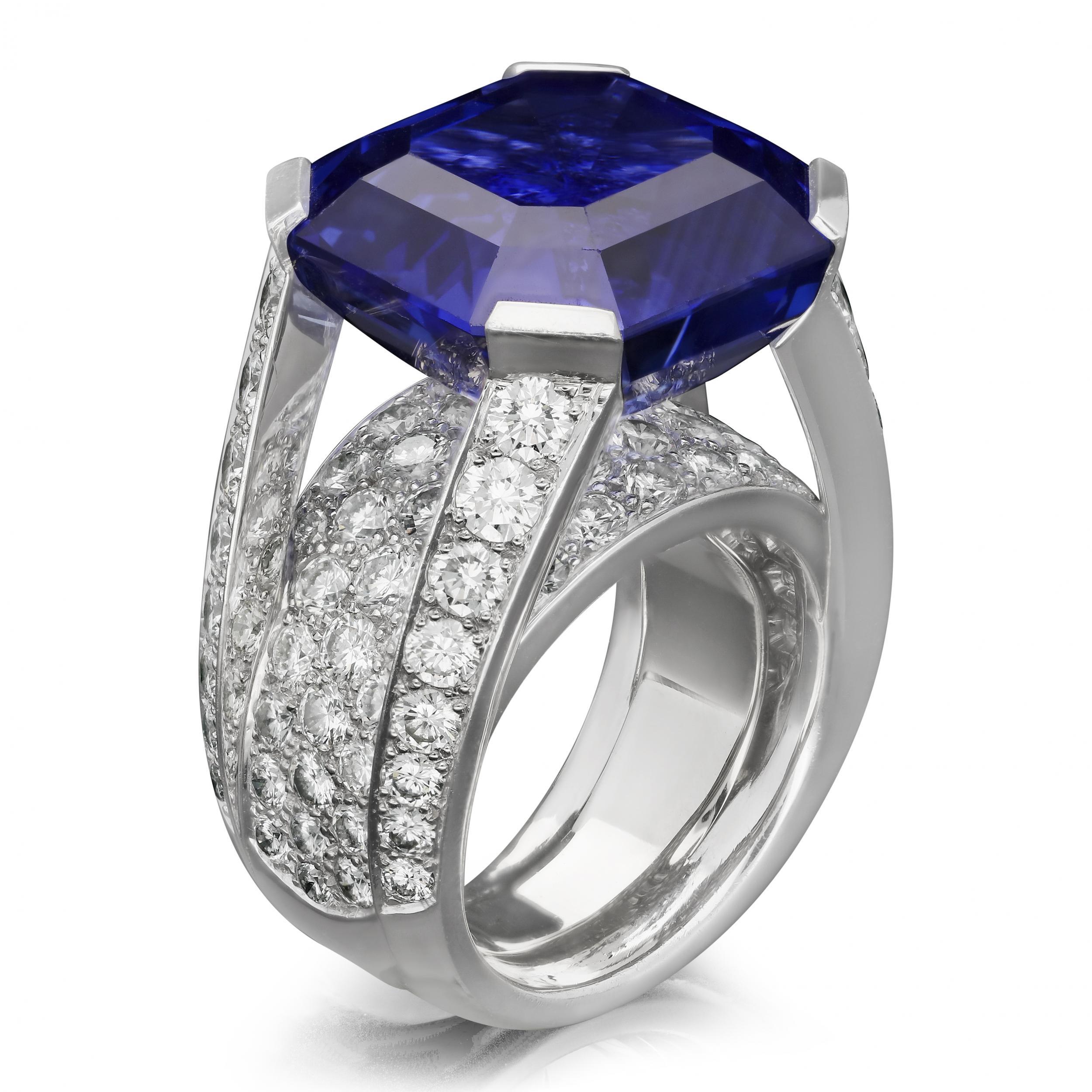 Description
A magnificent sapphire and diamond ring by Cartier c.2000s, centred with a beautiful octagonal blue Ceylon sapphire weighing 27.04ct set to each corner with a flat claw in an open gallery leaving the stone open to the light and raised