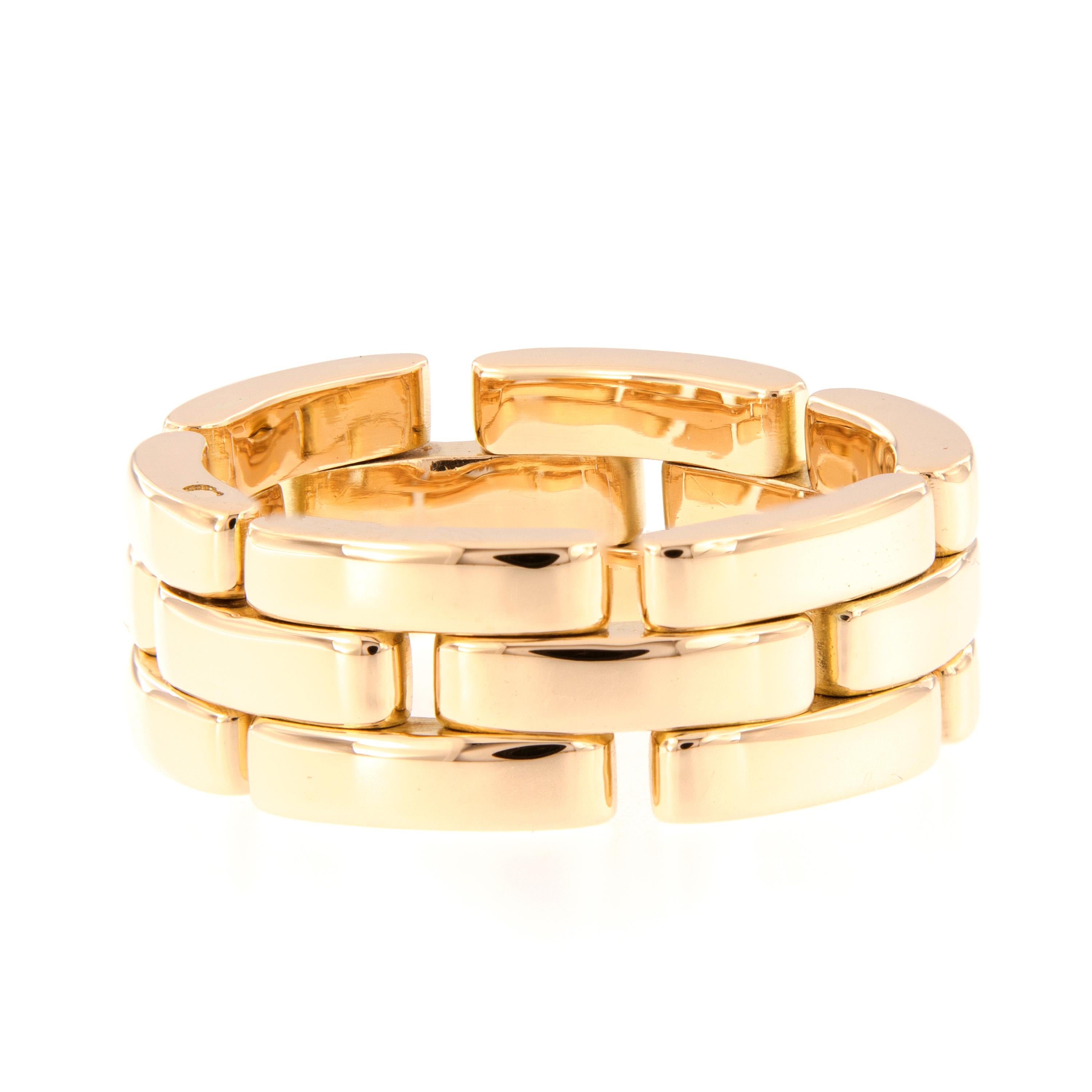 Link band ring by Cartier from the Maillon Panthere Collection is crafted in 18k yellow gold. This previously owned ring is in excellent condition. The ring is 8mm wide. Marked Cartier, ring size, serial number, and metal content. We also have the