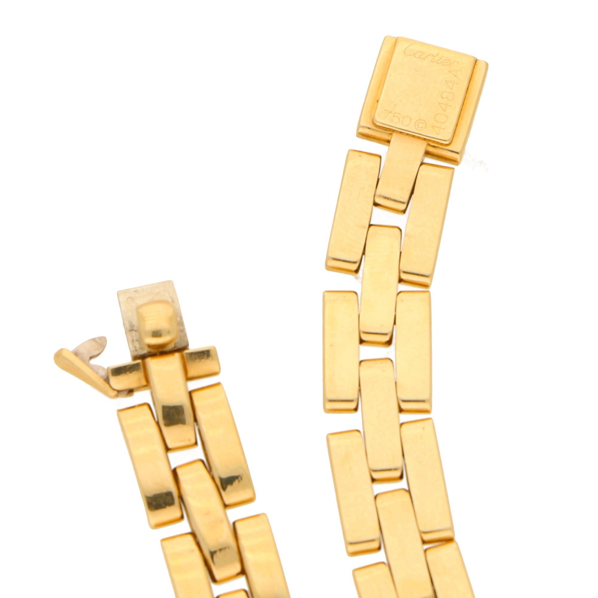 A Cartier Maillon Panthere bracelet in 18-karat yellow gold. This bracelet from the iconic Maillon Panthere collection is designed as three rows of polished yellow gold half-barrel-shaped links, to a doubly-secure click-shut and safety catch
