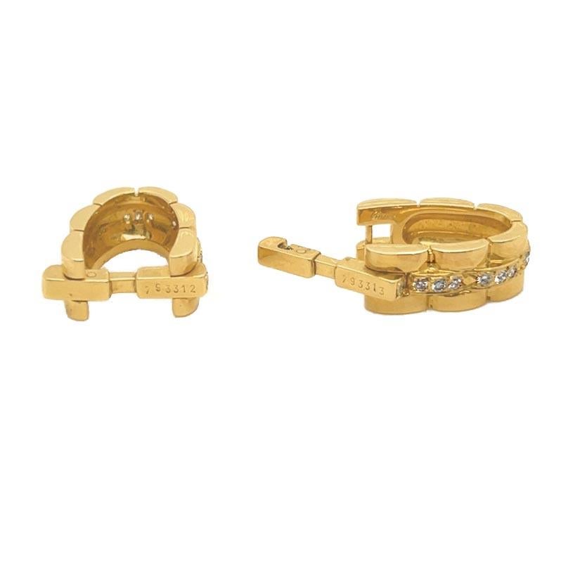Vintage Cartier 18K yellow gold, Maillon Panthere, Stirrup Cufflinks with diamonds. These cufflinks are a part of their signature Maillon Panthere link design. The 20 round brilliant cut diamonds weigh a total of 0.60 carats and are estimated to be