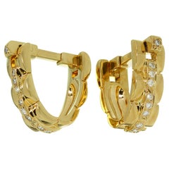 Gemelli Cartier Maillon Panthere in oro giallo con diamanti a forma di staffa