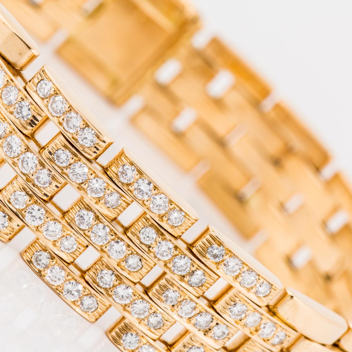 Cartier Maillon Panthère five-row gold link bracelet in 18K yellow gold with round brilliant-cut diamonds. The center portion has 19 links that are pavé-set with four diamonds each totaling 1.88 carats of diamonds, F-G color, VVS-VS clarity. The