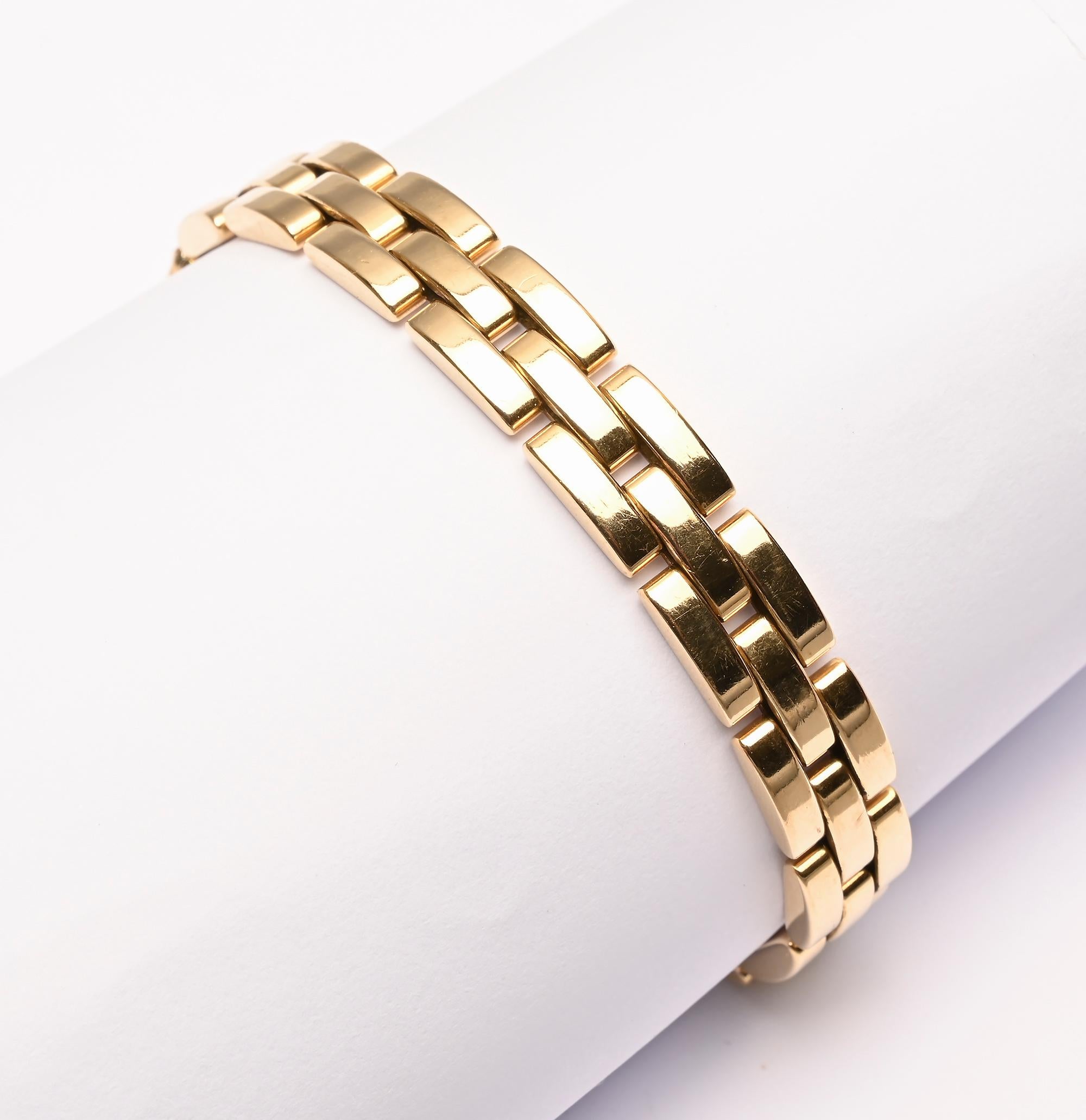 Classic Cartier links bracelet from their Maillon Panthere collection. The bracelet has three rows of rectangular links in a brickwork pattern. The bracelet measures 7 inches in length and 5/16