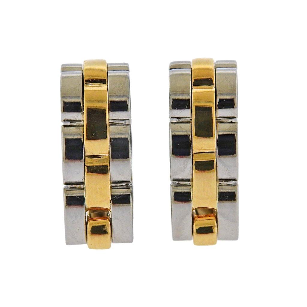 Pair of 18k gold and stainless steel stirrup cufflinks by Cartier from Maillon Panthere collection. Cufflink top is 19mm x 18mm x 8mm. Weight is 10.8 grams. Marked Cartier, 750, 725439.