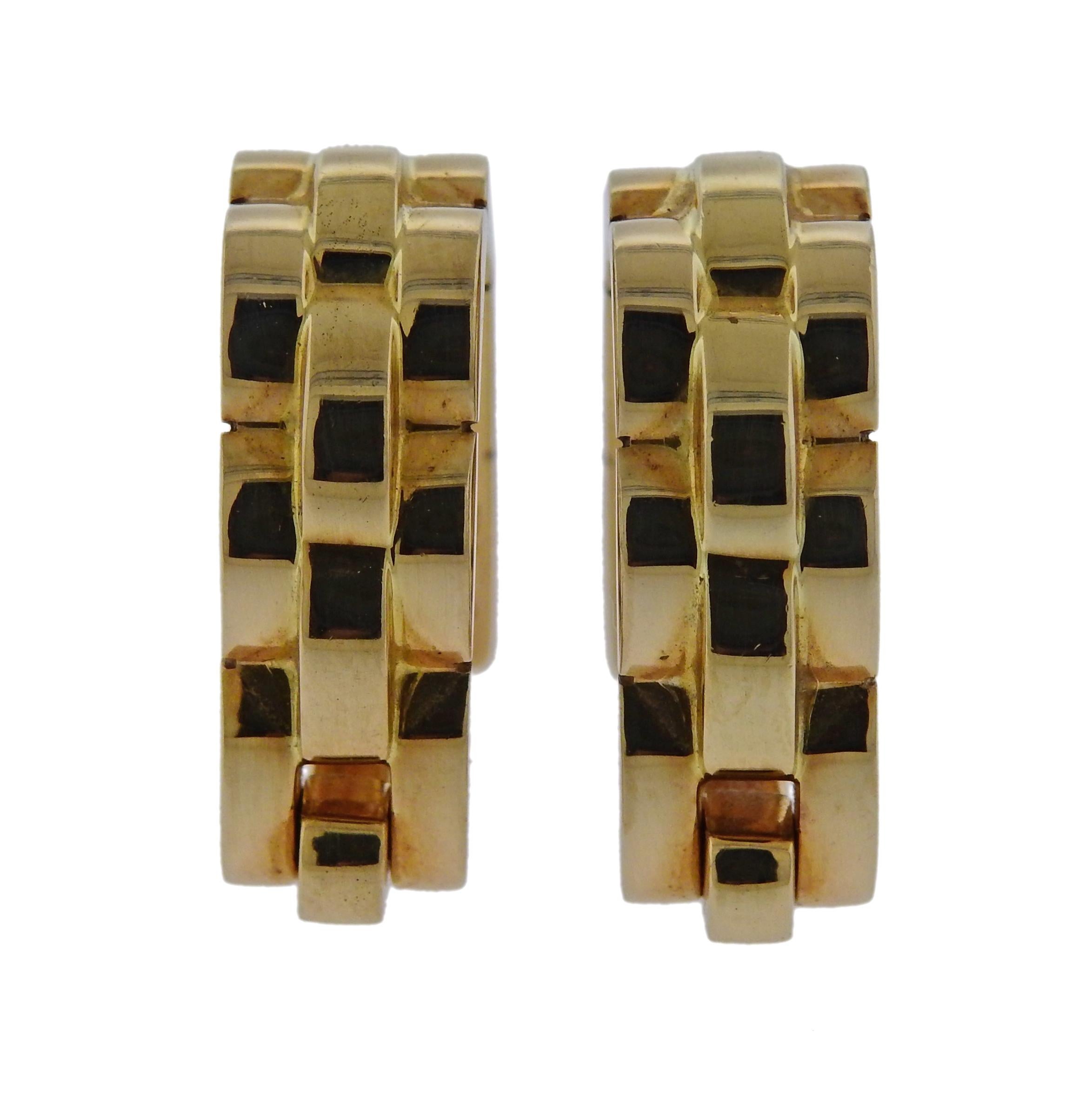 Pair of 18k yelow gold stirrup cufflinks, crafted by Cartier for Maillon Panthere collection. Cufflink measures approx. 18mm x 20mm , width 7.3mm. Weigh 17 grams. Marked: F56017, 750, Cartier.