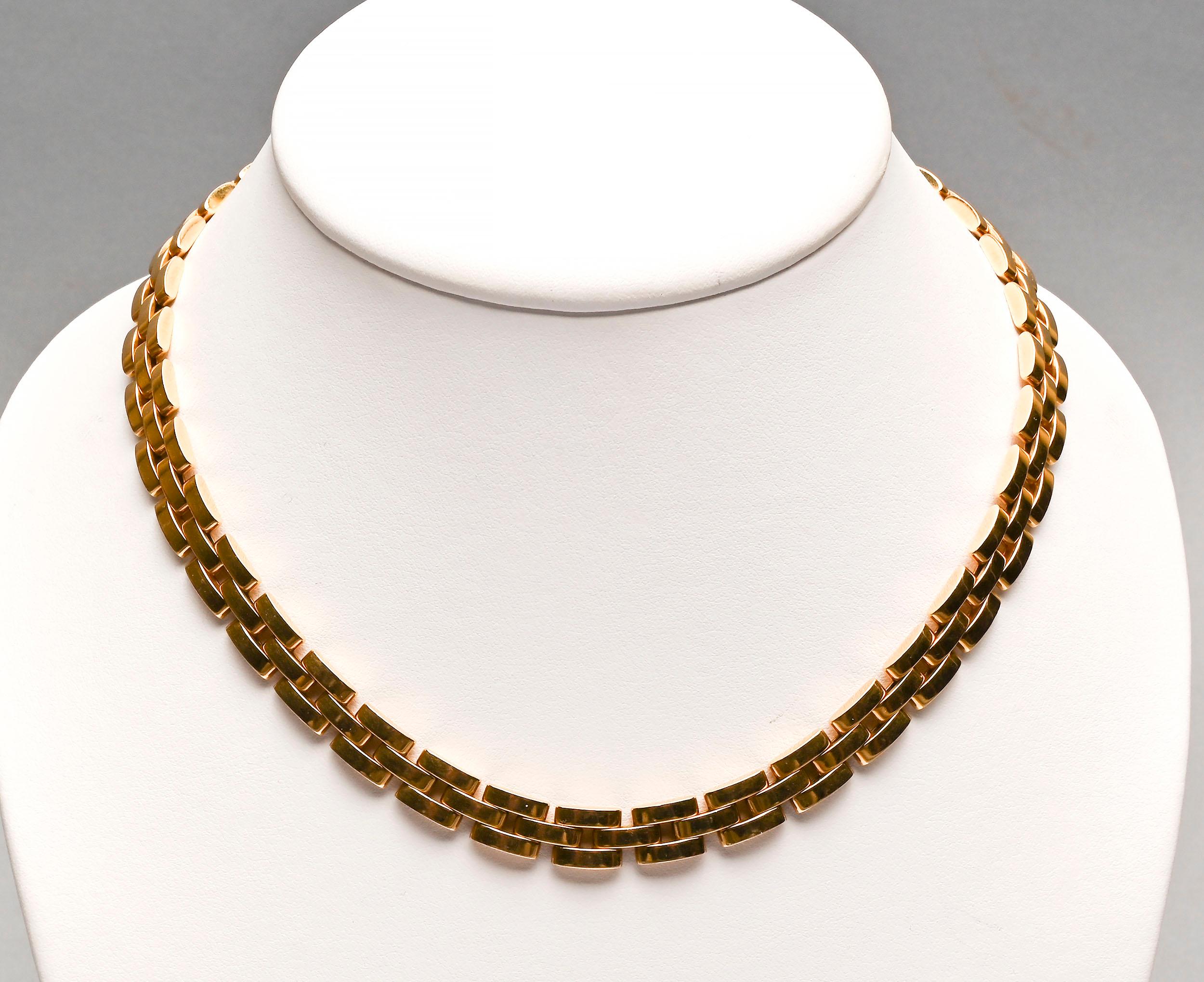 This triple row Maillon Panthere necklace by Cartier is one of their most timeless designs. It measures 16 1/2 inches in length and  5/16