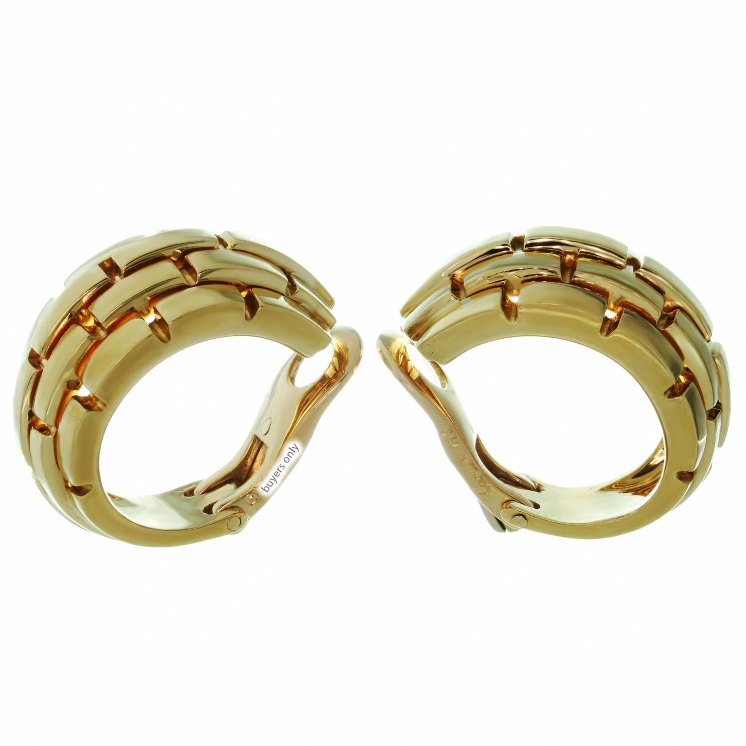 These classic Cartier wrap earrings from the iconic Maillon Panthere collection feature 5 rows of rectangular links crafted in 18k yellow gold. Made in France circa 2000s. Measurements: 0.47