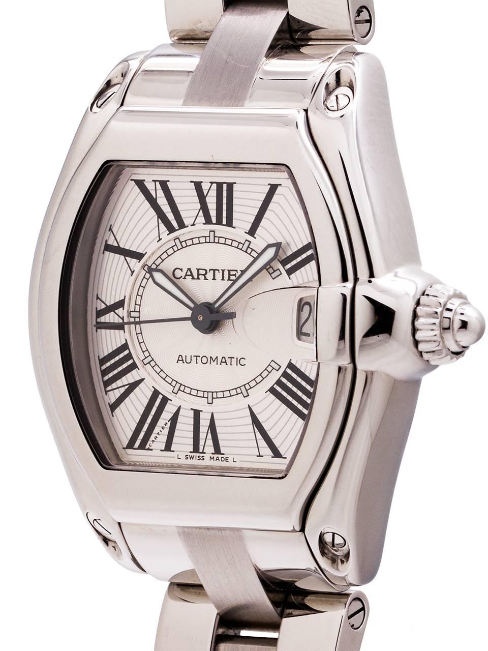 
Cartier Man’s Roadster automatic ref# 2510 circa 2000s. 38 x 44.5mm tonneau shaped Stainless Steel case with steel cabochon style screw down crown, matte silvered textured dial with black stretch Roman numerals, and black outline kite shaped