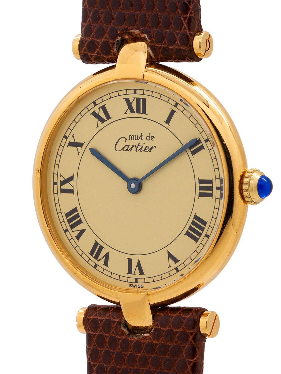 
Cartier man’s vermeil Vendome Tank wristwatch circa 1990s. Case mesuring 30.5 x 37mm with T-bar lugs. Featuring an original cream dial with classic printed Cartier Roman numbers with blued steel hands and blue sapphire cabochon crown. Battery