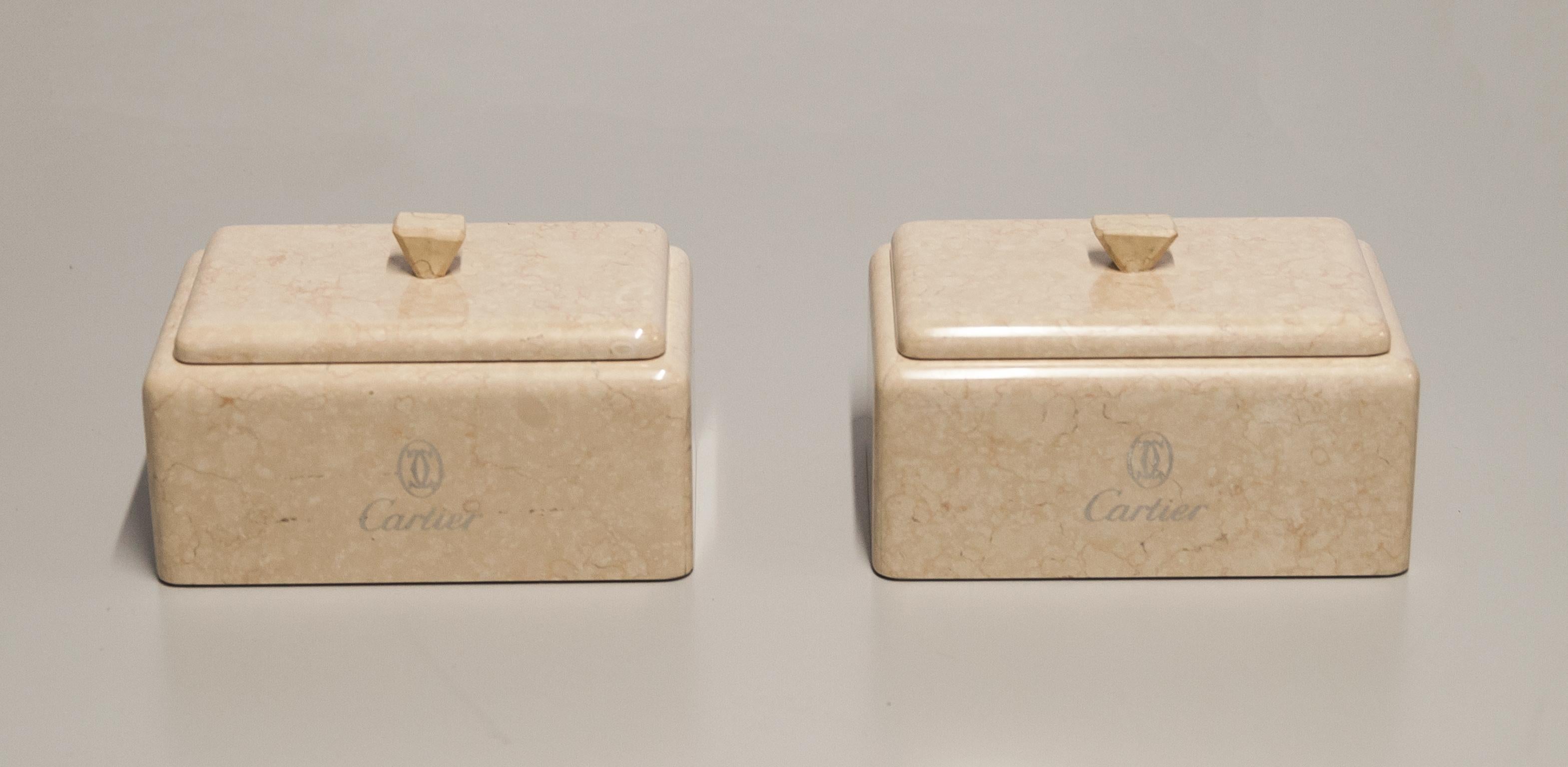Elegant marble boxes made for Cartier with the silver engraved Logo in excellent condition.
