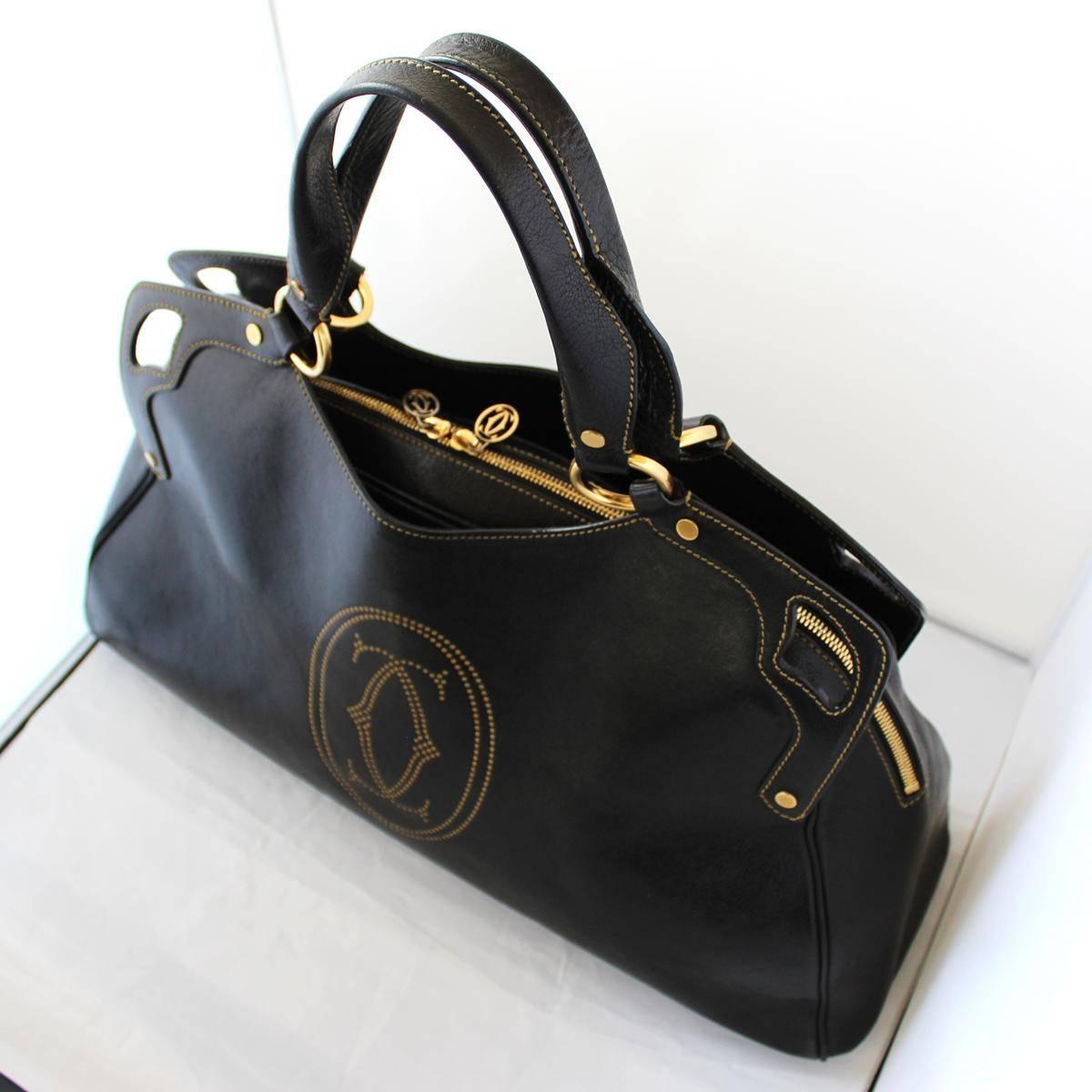 Leather
Black color
Two handles
Golden brass elements
Zip closure
Two external pockets
Internal zip pocket and phone holder
Cm 48 x 28 x 18 (18.8 x 11  x 7 inches)
Worldwide express shipping included in the price !