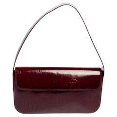 Cartier Maroonfarbene Must de Cartier Baguette-Tasche aus Lackleder