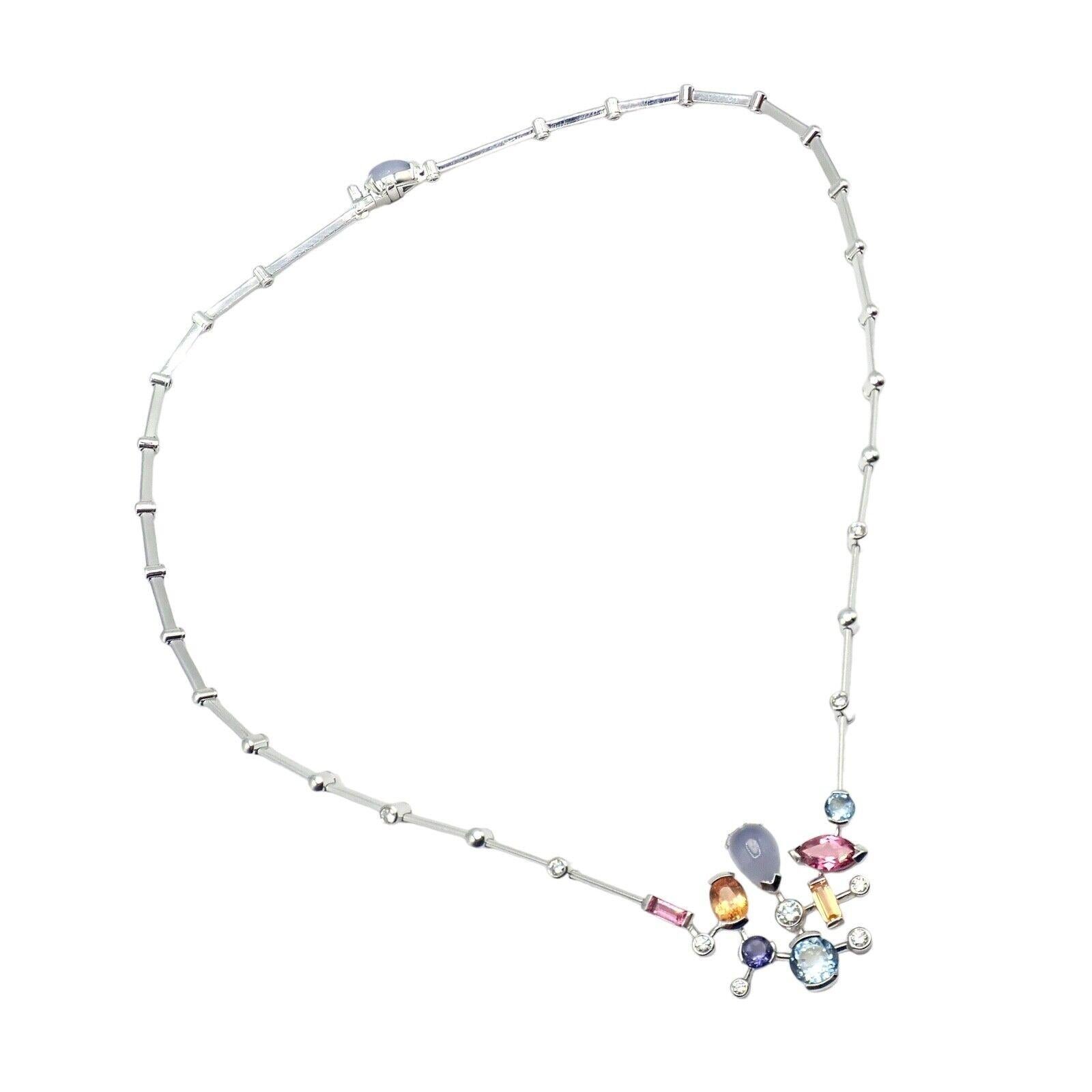 The Authentic Cartier Platinum Diamond Meli Melo Gemstone Necklace is a true statement of luxury and sophistication. Crafted in platinum, the necklace showcases a stunning combination of diamonds and colorful gemstones arranged in a meli melo