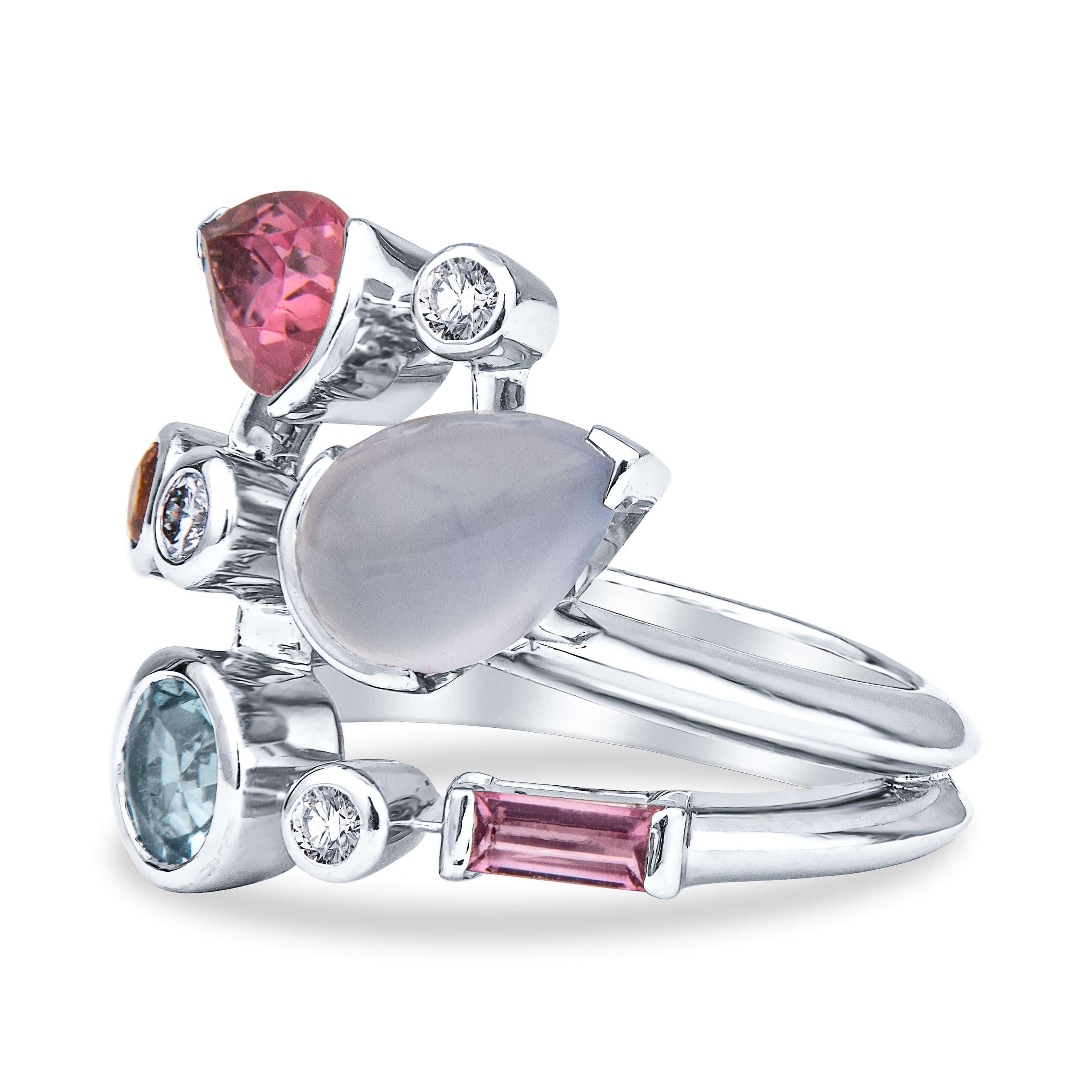 This early 2000s Cartier Meli Melo piece is a beautifully crafted platinum vine ring with several rows of an assortment of precious gemstones in a variety of cutting styles. With 3 round brilliant diamonds at approximately 0.15ctw, accented with