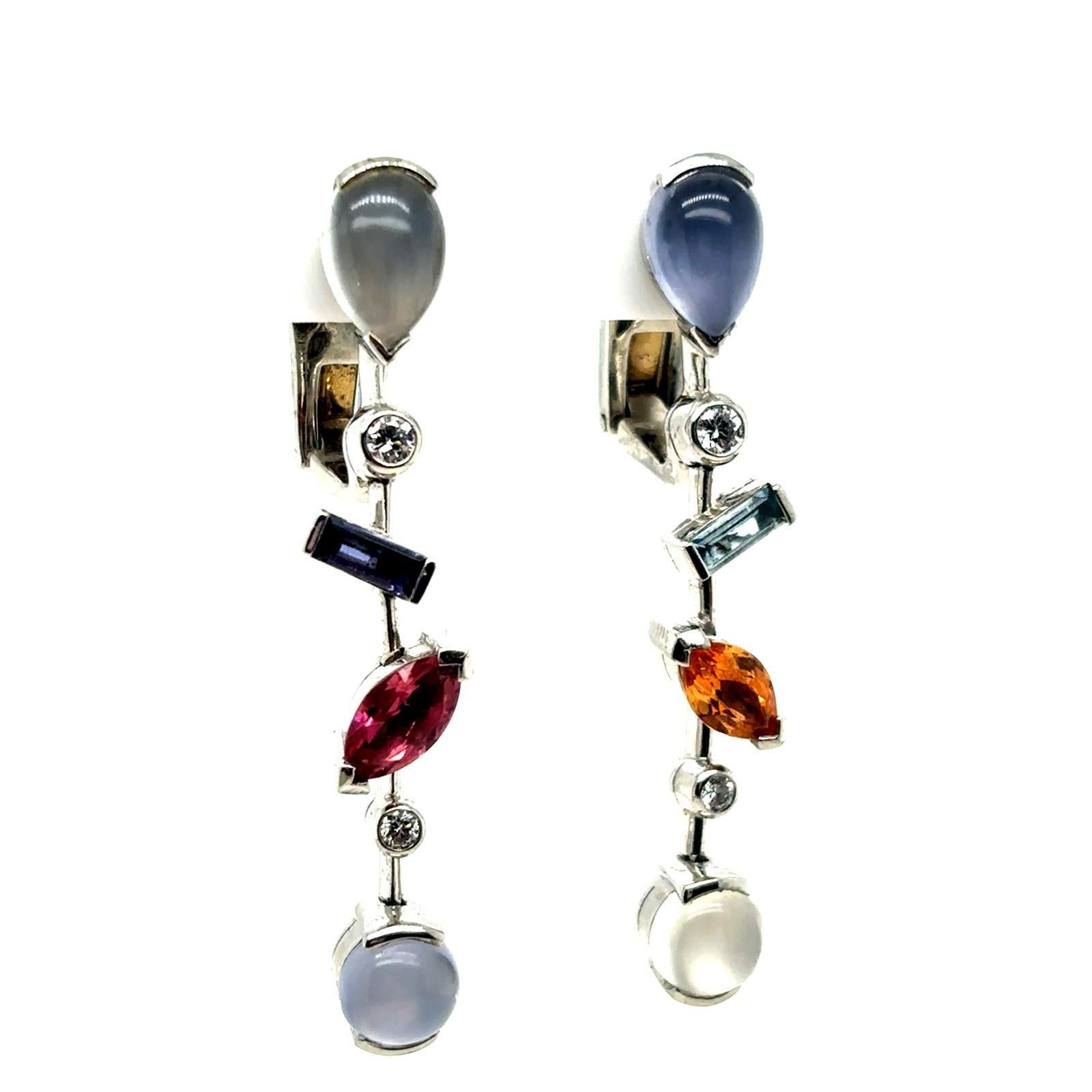 Un paio di orecchini a goccia in platino Cartier Melo, CIRCA 2000

Questo paio di orecchini a goccia dell'intramontabile collezione Melo di Cartier è composto da un design a cascata di diamanti a taglio variabile e pietre preziose di acquamarina,