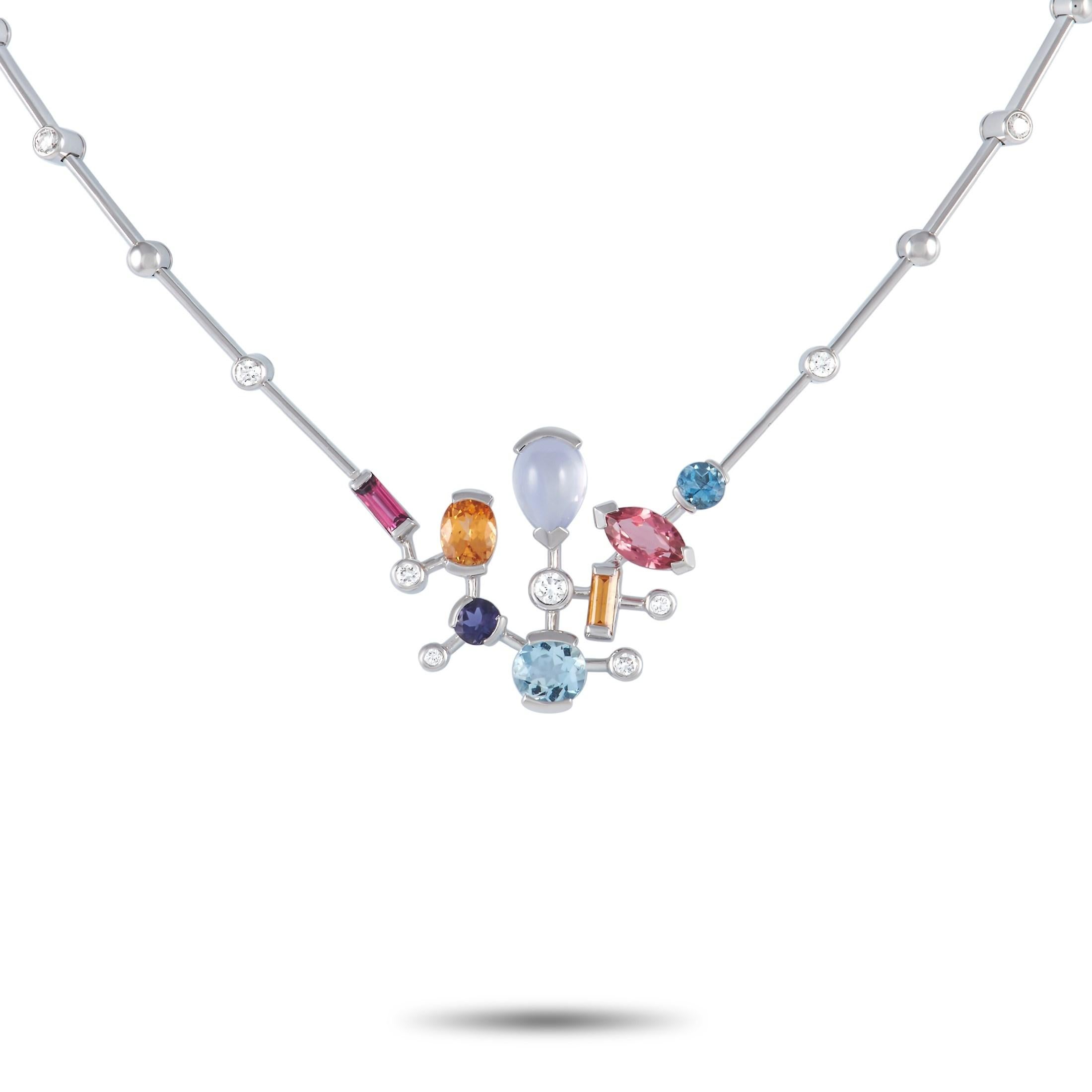 Delivering a playful fashion statement is this Cartier Meli Melo 18K White Gold Multi-Gem Necklace. Mounted on a geometric pendant in white gold are various-shaped gemstones including aquamarine, moonstone, iolite, pink tourmaline, and chalcedony.
