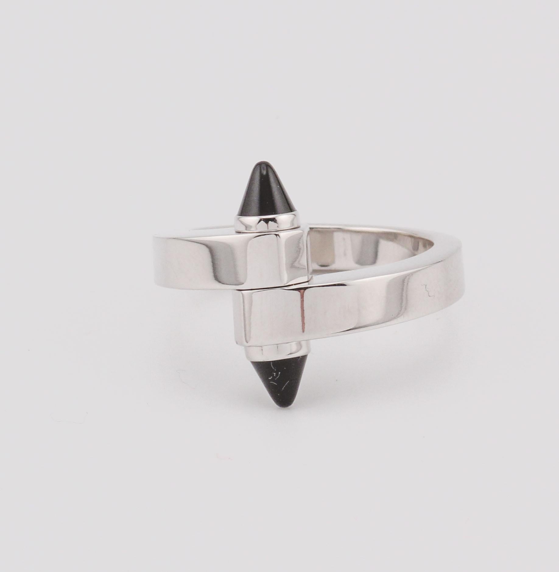 This Cartier Onyx Ring is a striking example of modern design and luxury craftsmanship. The centerpiece features a bold black onyx, expertly cut into a sleek cone shape, creating a dramatic focal points that exudes sophistication.

Crafted from 18k