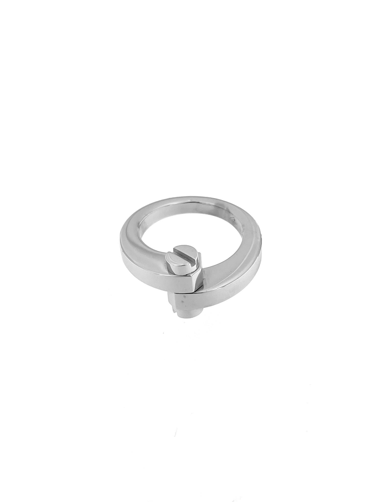 The Cartier Menotte Ring in 18-karat white gold is a refined and elegant piece of jewelry designed for sophistication and style by the renowned French luxury brand, Cartier. The Menotte collection is characterized by its distinctive handcuff motif,