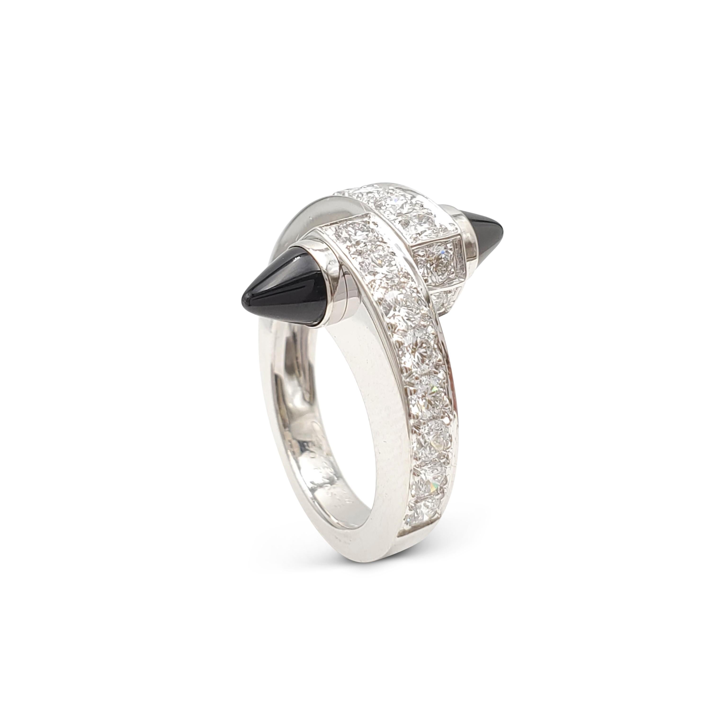 Authentic Cartier bypass ring from the 'Menotte' collection is crafted in 18 karat white gold and features two pointed polished black onyx gemstones set at the end of each bypass. The ring is set with an estimated 0.80 carats of high-quality round