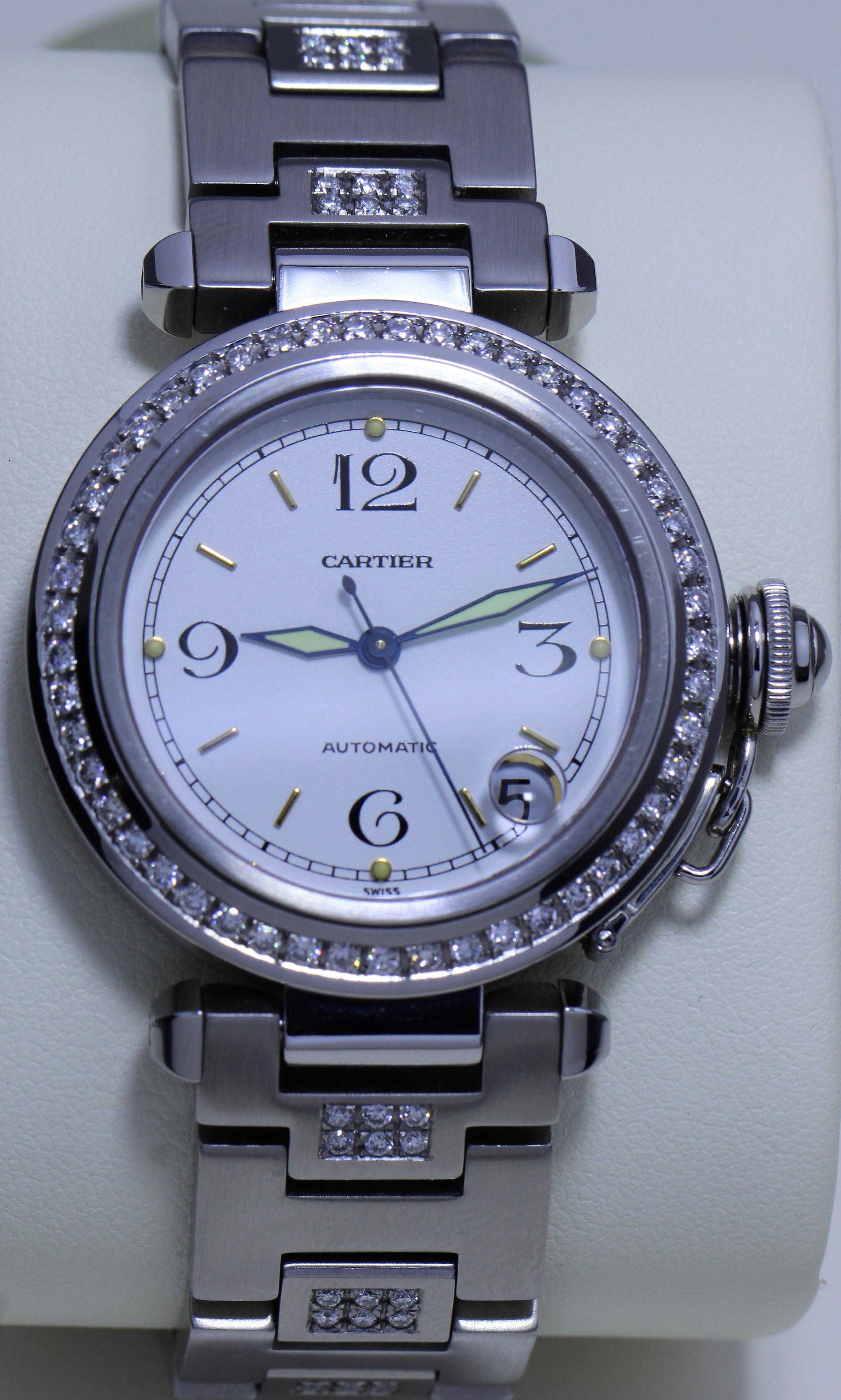 Cartier Men's Diamond Studded Automatic Watch

Diamond Studded band and bezel
White Face with Date Display
Phosphorescent hands