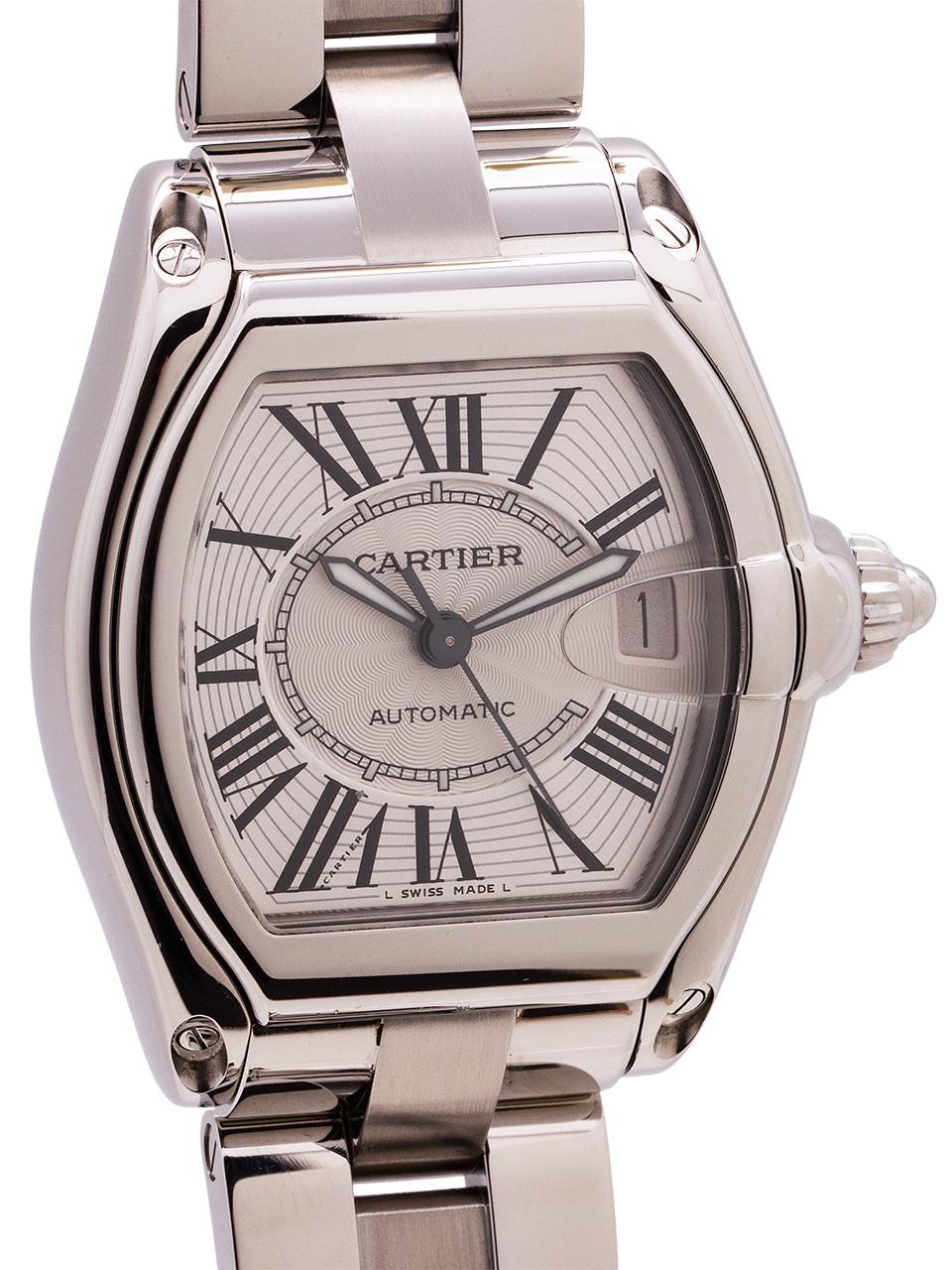 
Cartier Man’s Roadster automatic ref# 2510 circa 2000s. 38 x 44.5mm tonneau shaped stainless steel case with steel cabochon style screw down crown, matte silver textured dial with black stretch Roman numerals, and black outline kite shaped luminova