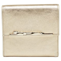 kompakte Cartier-Brieftasche aus Metallic-Goldleder