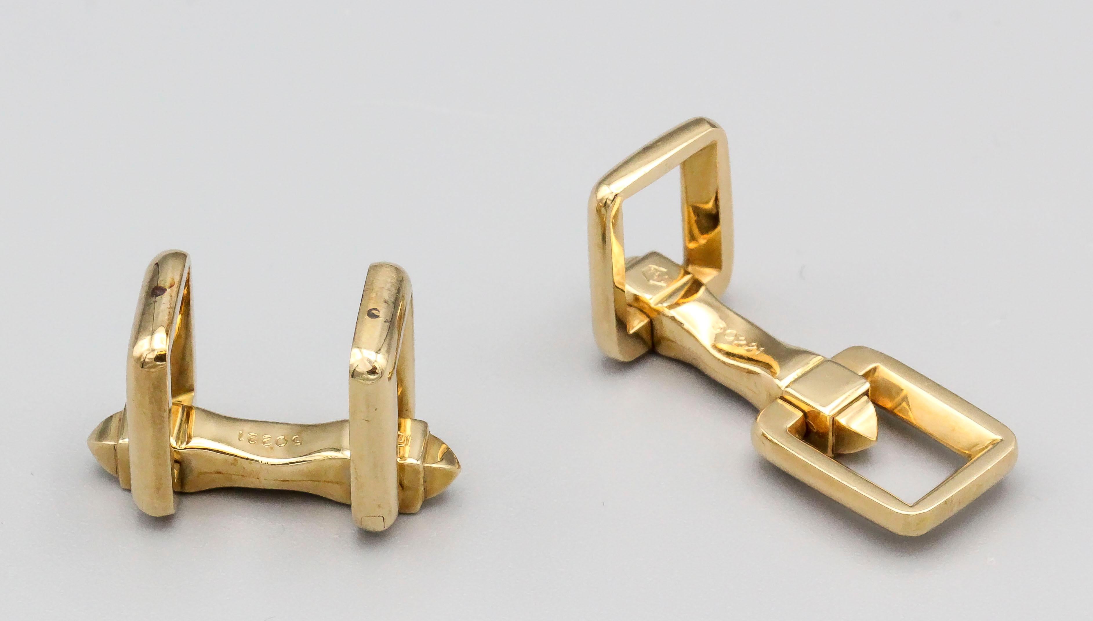 Fine pair of 18k gold folding cufflinks by Cartier, circa 1950s.

Hallmarks: Cartier, 750, reference numbers.