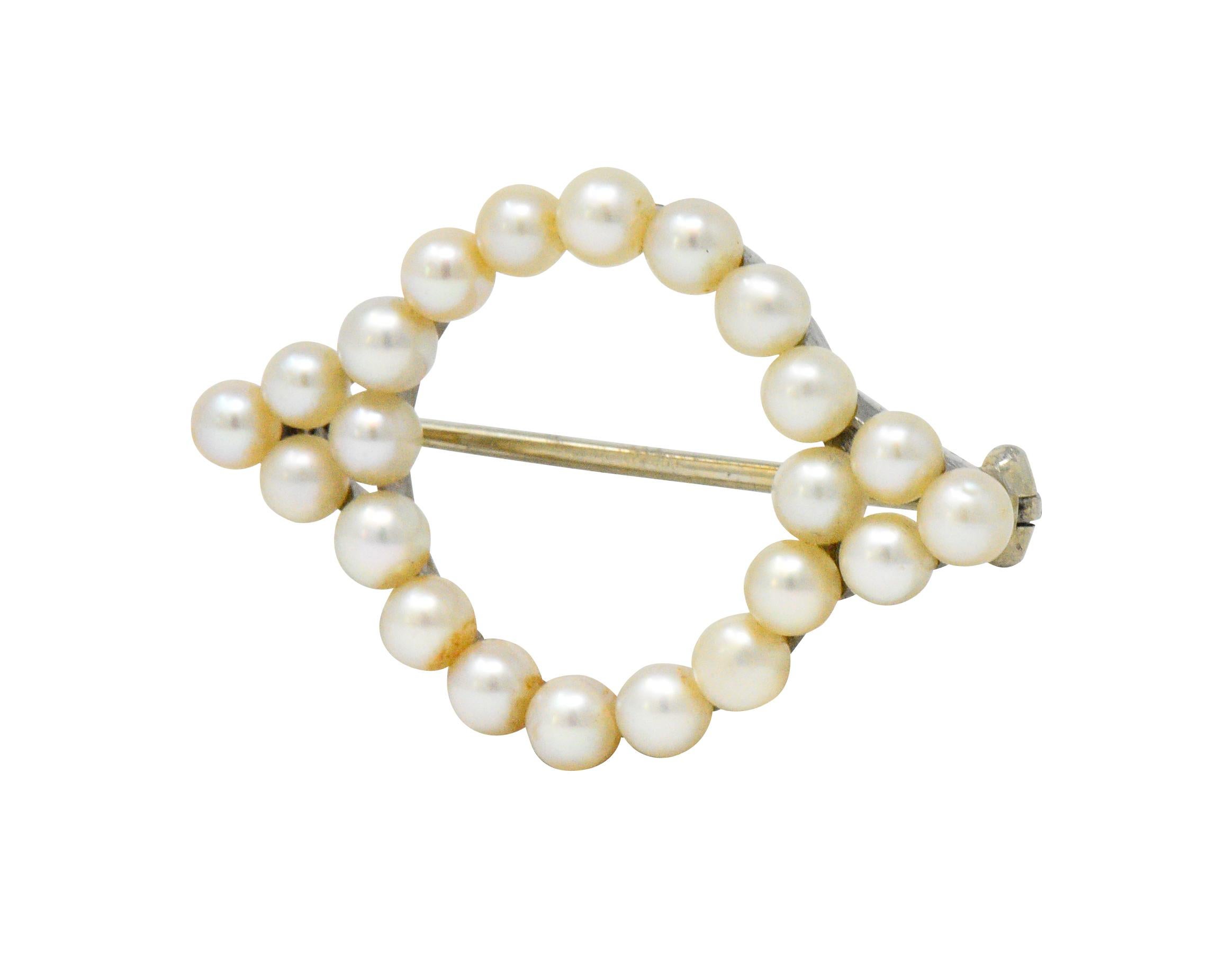 Featuring 22 white cultured pearls on platinum setting

Pearls are 4.5 mm with good to very good luster and pale pink shades

Circa 1940's and signed Cartier

Measures 1 3/8