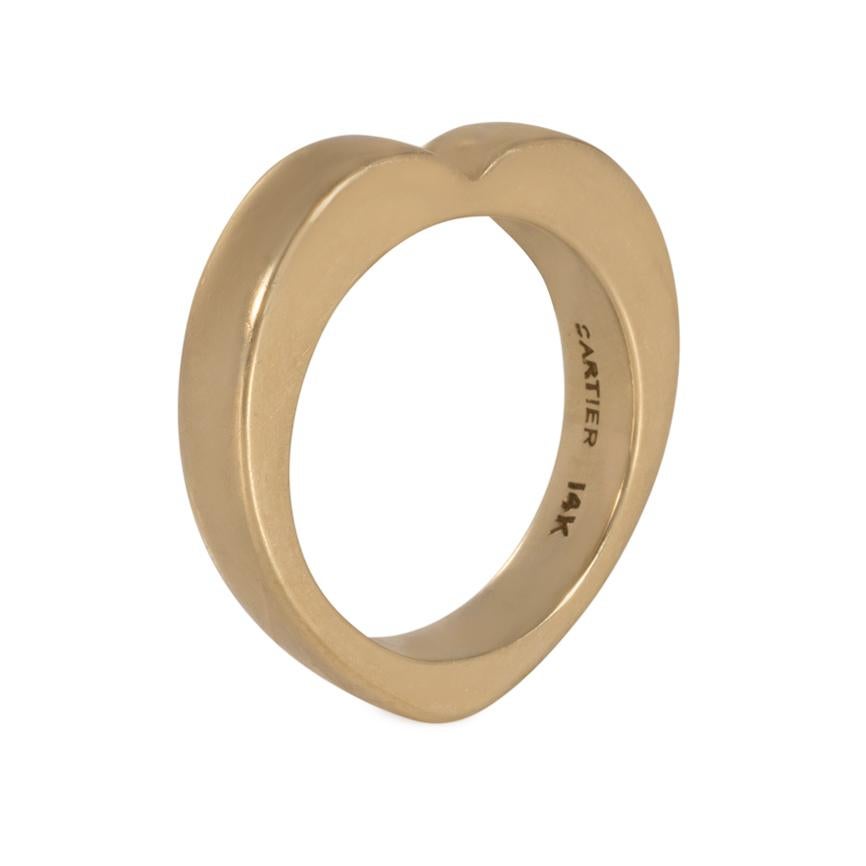 A Retro gold band ring in the form of a heart, in 14k. Cartier.  Approximately 4mm wide.  Size 5 1/2