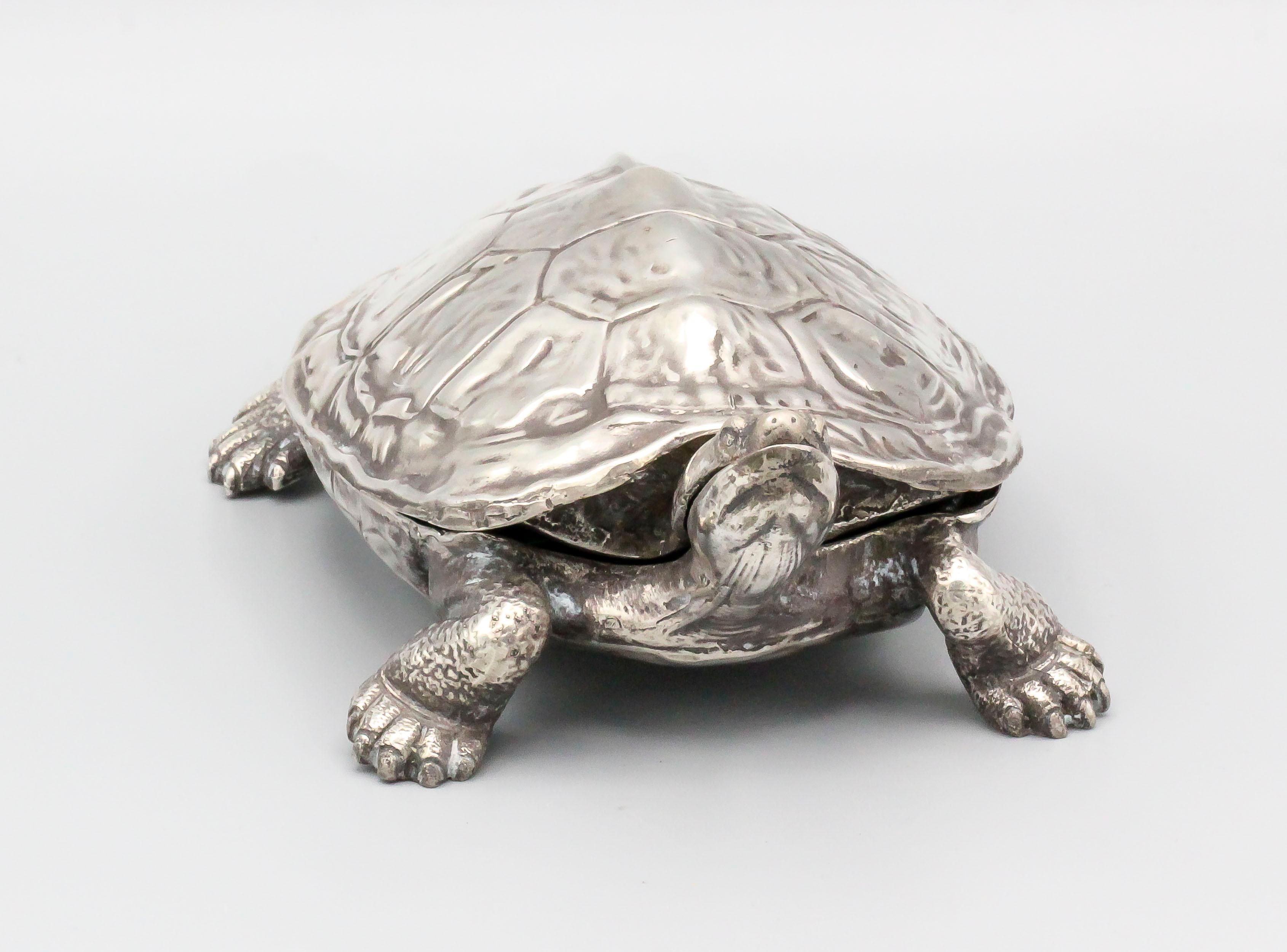 Fine and rare sterling silver box in likeness of a turtle, by Cartier circa 1950-60s. The shell of the turtle is removable and the inside can be used for storage.

Hallmarks: Cartier Sterling