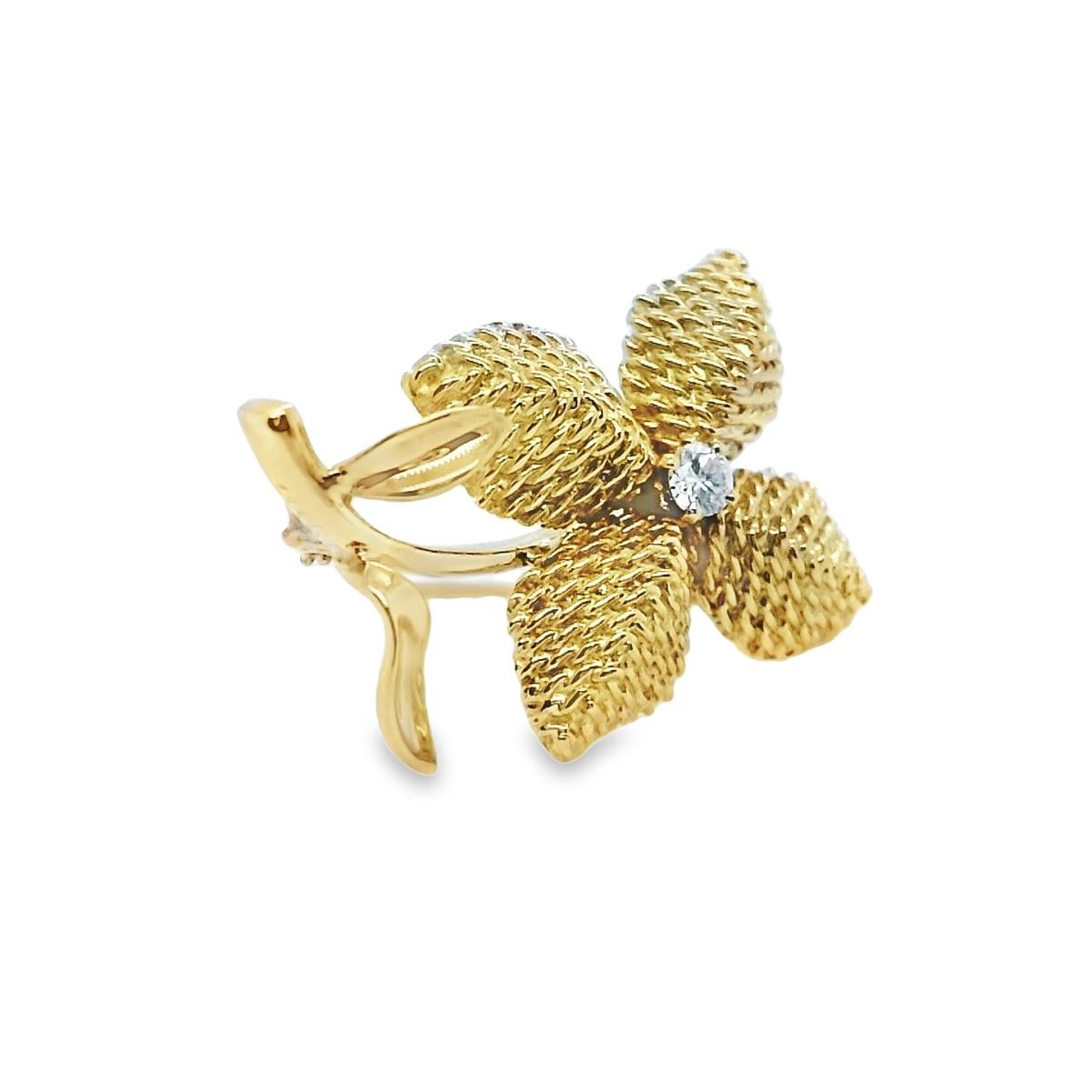 Cartier very rare example of a diamond Brooch. 

Mid-century approx 1950s, depicts a beautiful flower, crafted using traditional carving, and textured work, bringing this beautiful brooch to life. 

Set with a round-brilliant cut diamond approx