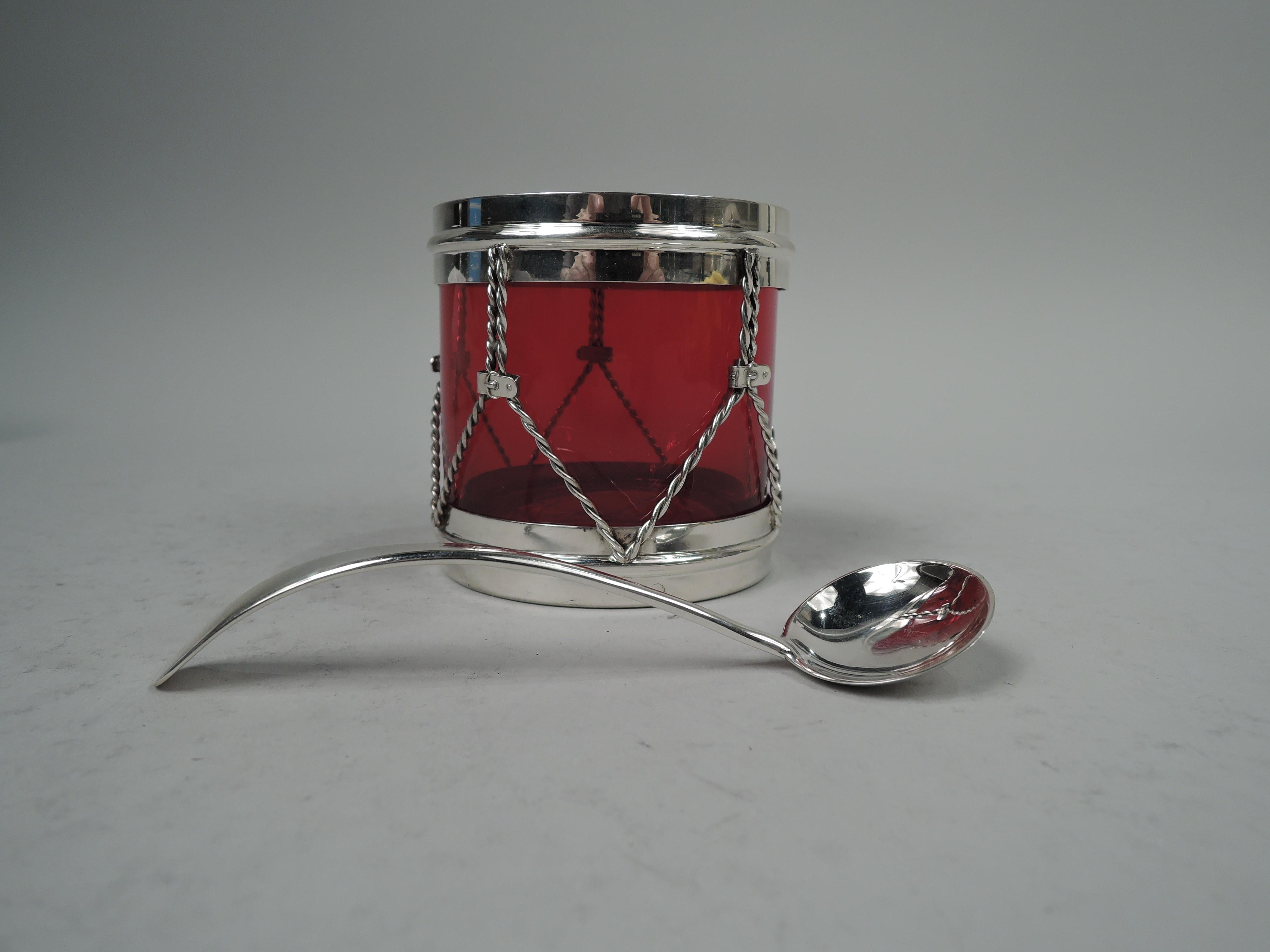 Midcentury Modern sterling silver novelty and glass jam jar with spoon. Made by R. Blackinton & Co. in North Attleboro, Mass. Glass body with sterling silver hoops and cords. Inset cover with crossed drumsticks finial. Glass is red. Spoon has