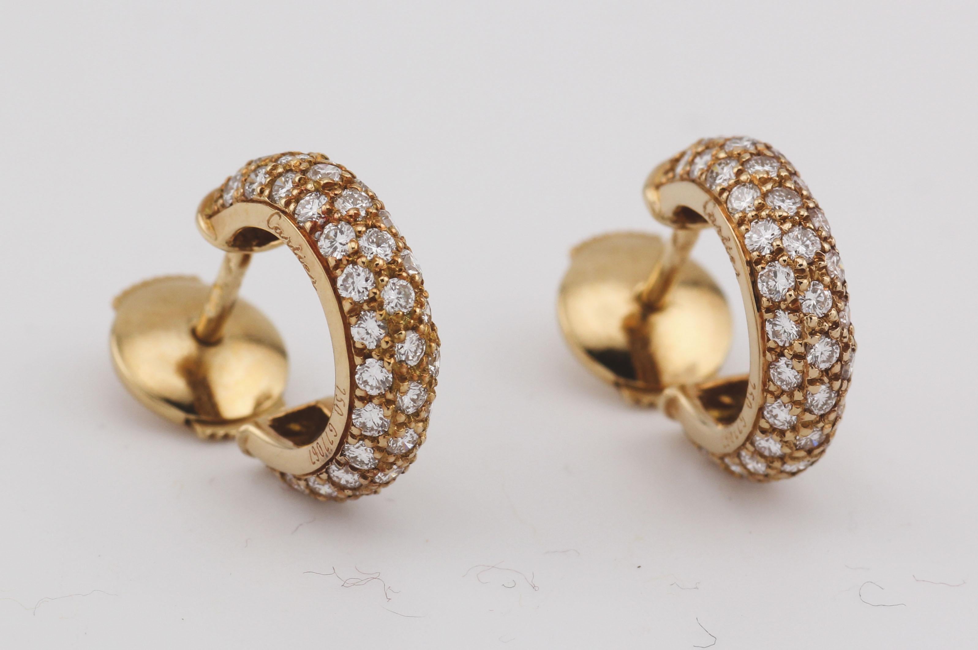 Elevate your elegance with the Cartier Mimi Diamond 18k Gold Hoop Earrings—a dazzling embodiment of sophistication and luxury. Crafted by the esteemed house of Cartier, these earrings showcase the brand's commitment to excellence in design and