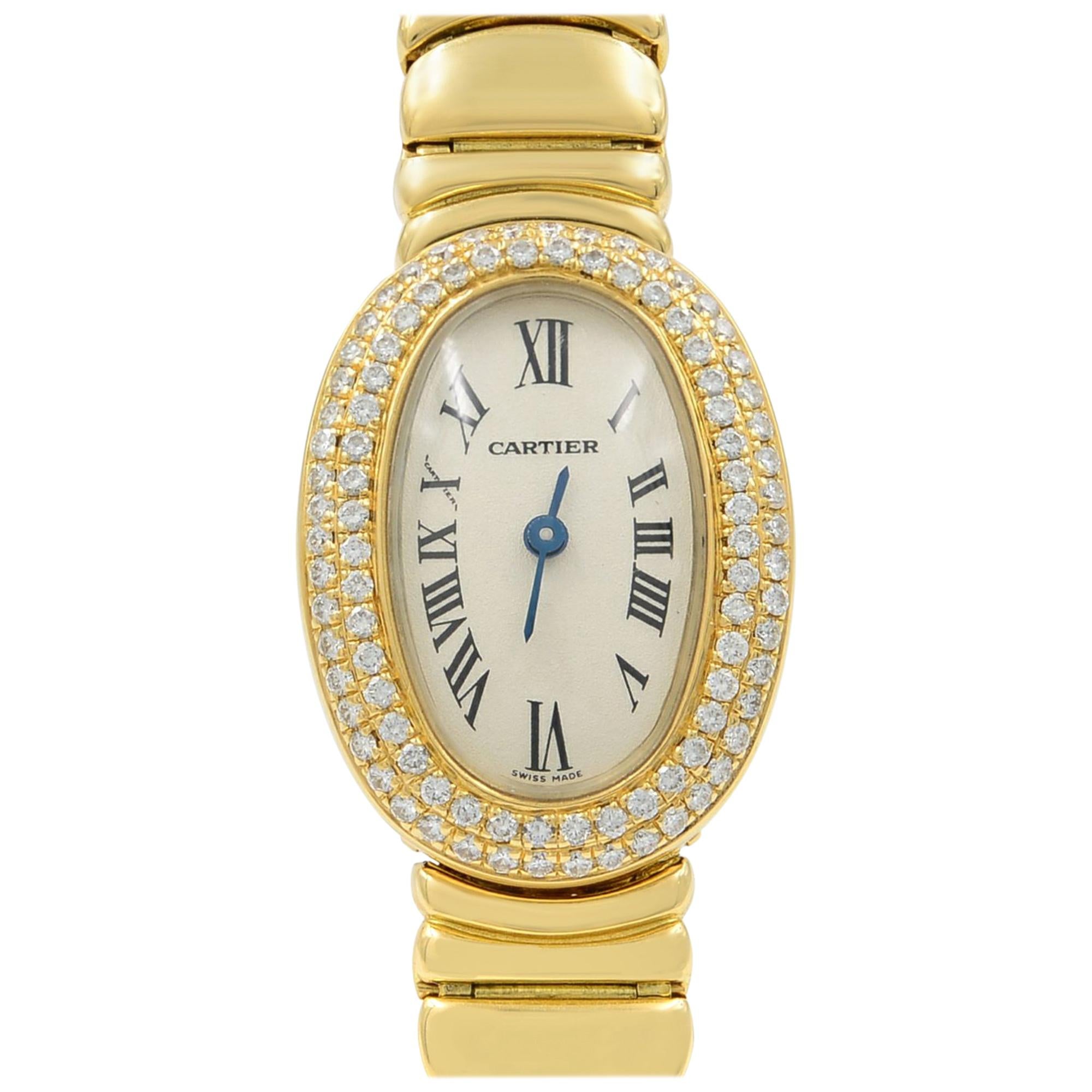 This pre-owned Cartier Baignore  WB5094WI is a beautiful Ladies timepiece that is powered by a quartz movement which is cased in a yellow gold case. It has an oval shape face, diamonds dial, and has hand roman numerals style markers. It is completed