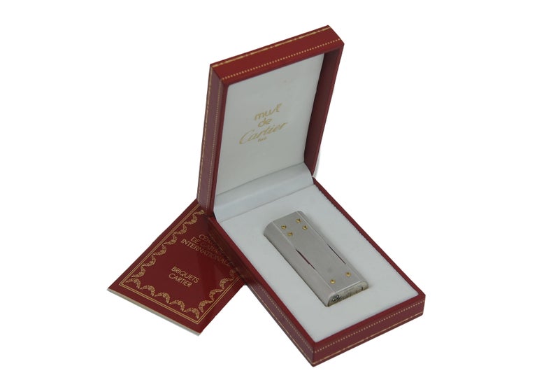 cartier santos tobacco 100 Straps sided crown with a synthetic blue spinel at its tip Cartier Cigarettes
