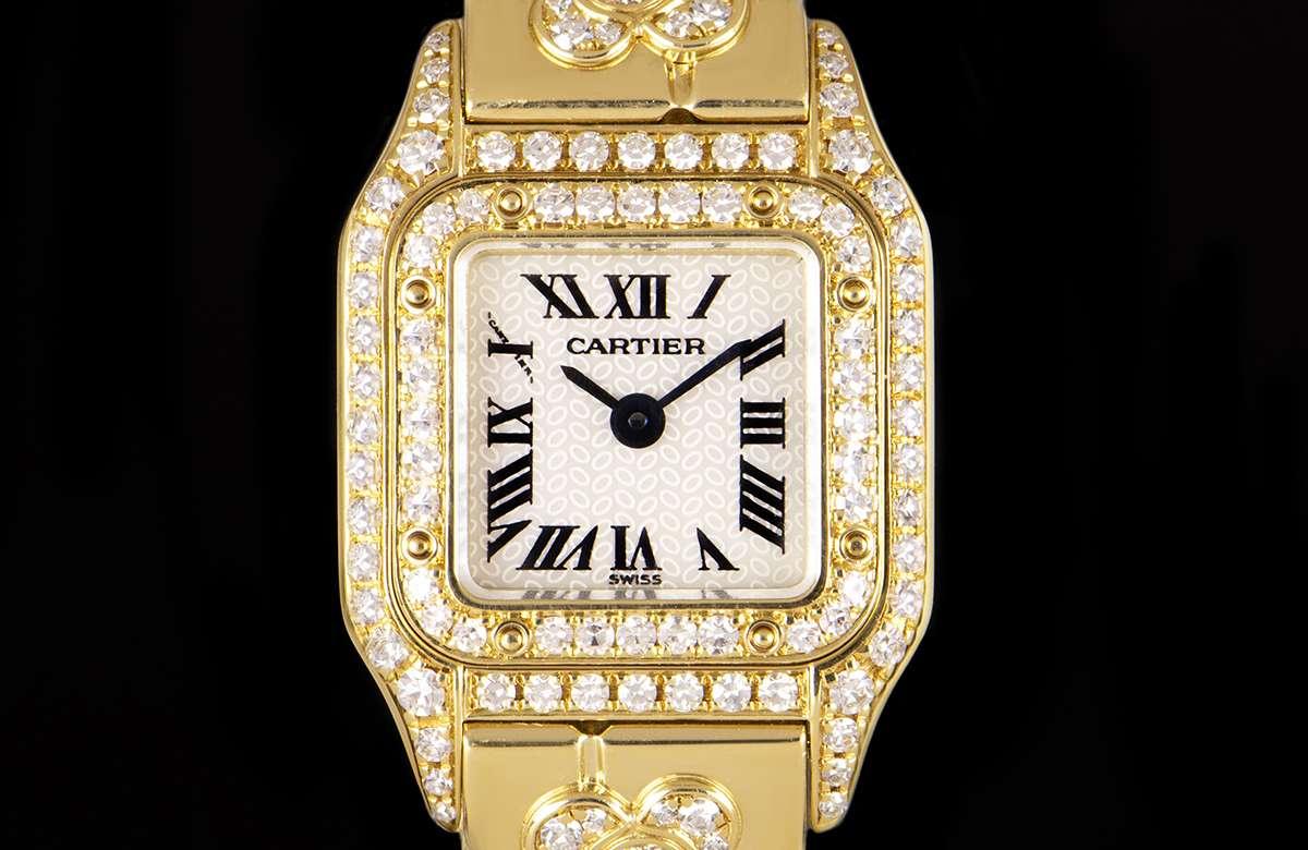 An 18k Yellow Gold Panthere Mini Ladies Wristwatch, white mother of pearl dial with roman numerals and a secret signature at 