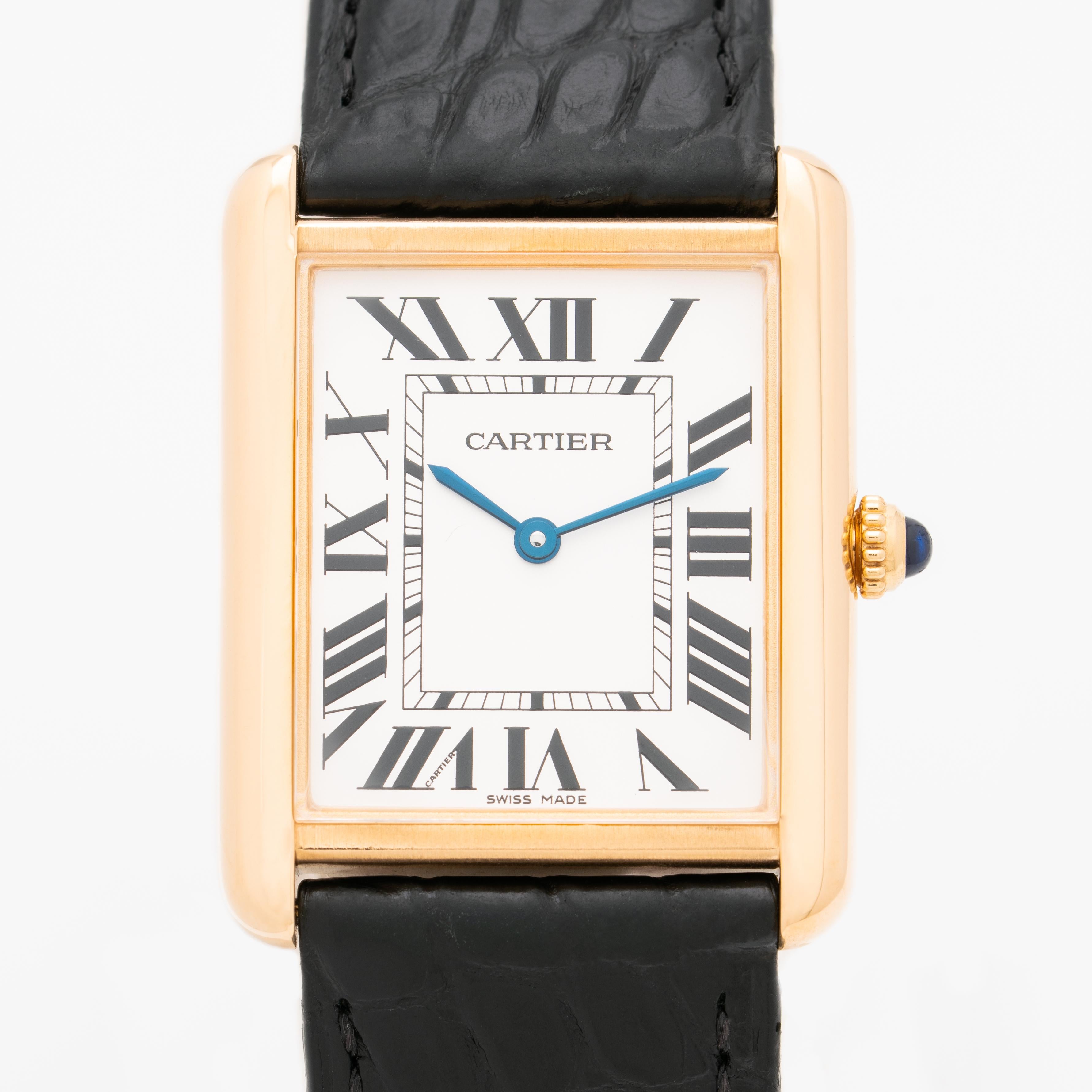 Cartier Model 3187 Tank Solo 18 Karat Yellow Gold and Stainless Steel Watch 
matte silvered dial signed CARTIER with secret signature at 7 o'clock, black Roman numerals, blued steel word hands, steel case back affixed by four screws, quartz