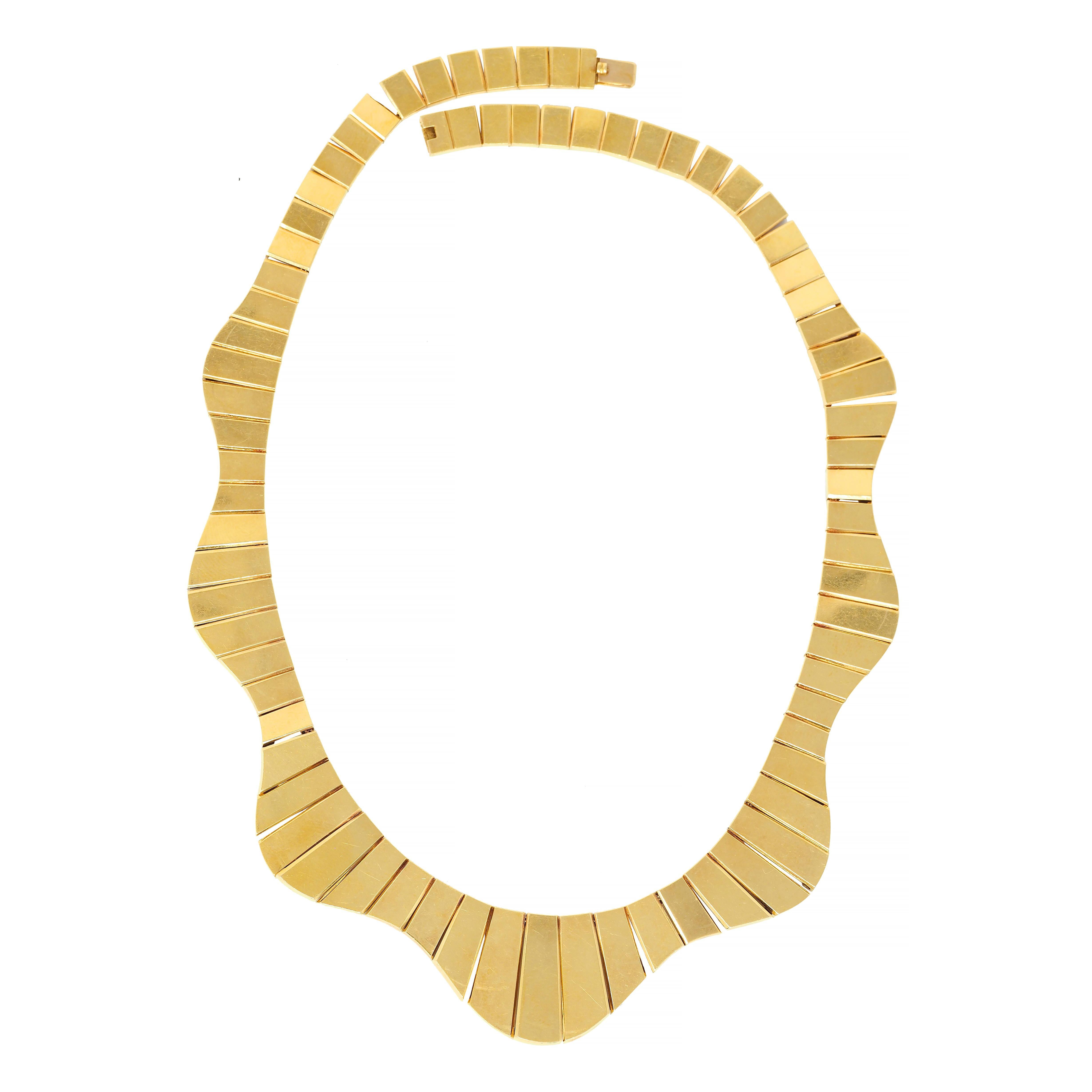 Comprised of fitted tab-like segments strung along rope chain
Displaying an undulating wave motif 
With high polish finish 
Stamped for 18 karat gold 
Numbered and fully signed for Cartier, Ca.
Circa: 1960s
Width at widest: 7/8 inch
Length: 16