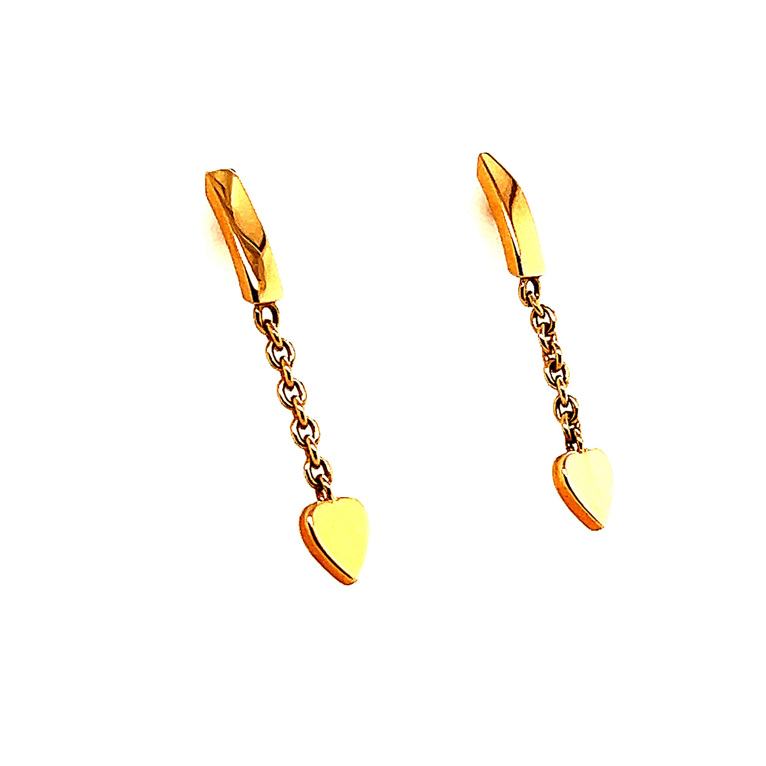 Beautiful every day earrings crafted from fame designer Cartier. The pair is from the mon amour line and crafted in 18k rose gold. The pair shows stud like post earrings with a short chain that leads to a dangling heart. These earrings are delicate