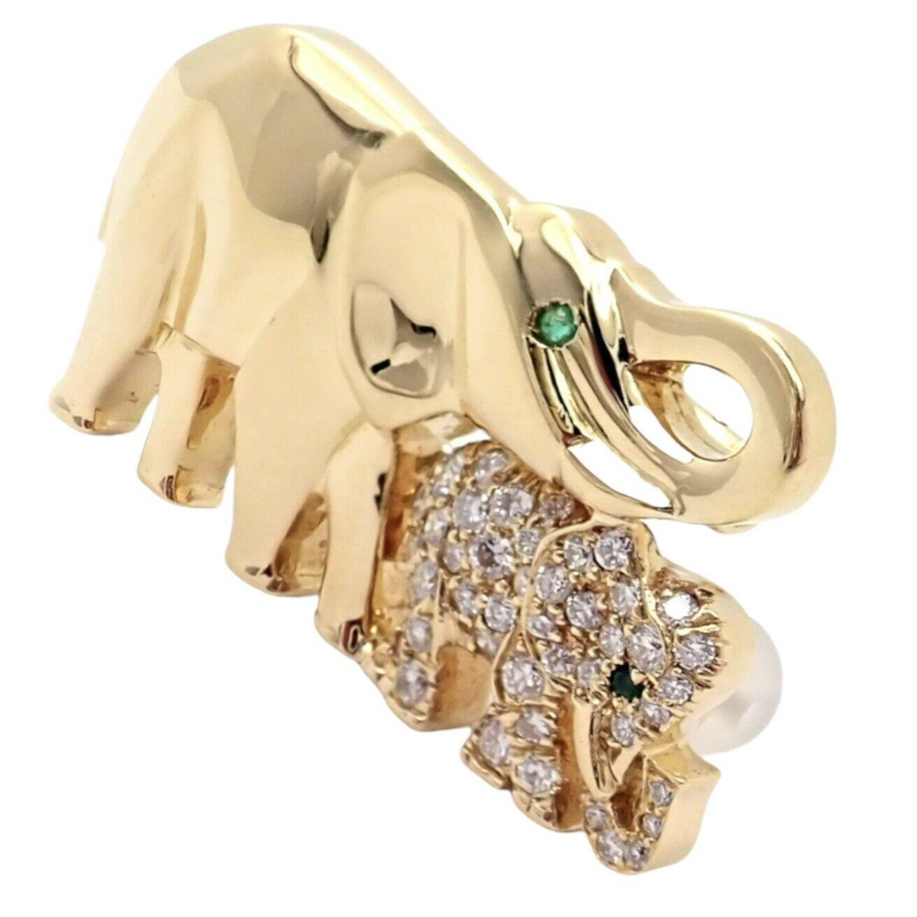 18k Yellow Gold Diamond Emerald Mother and Child Elephant Brooch Pin by Cartier. 
With 2 Round Emeralds
43 Round Brilliant Cut Diamonds, G/VVS1 Approximately 0.50ctw
This brooch comes with a service paper from a Cartier store.
Details:
