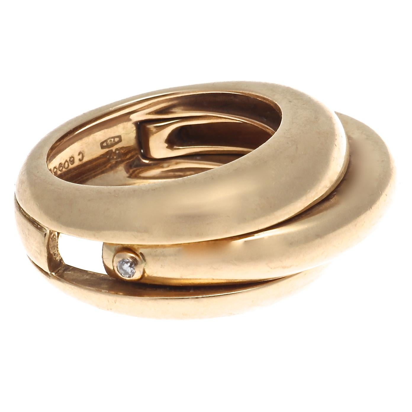 A truly unique gold ring from the iconic house of Cartier. We've all seen the Trinity and Love rings by Cartier, but this is truly a rare find. We don't know how many of these beauties were made but I'm guessing the number pales in comparison to the