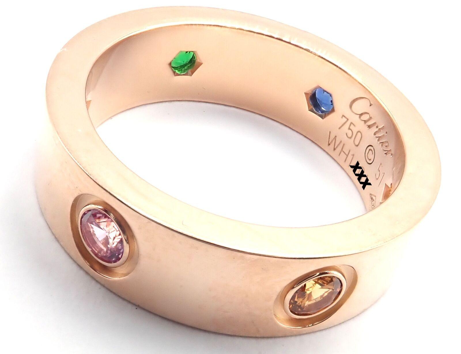 18k Rose Gold LOVE Multi-Gem Band Ring by Cartier. 
With 1 round yellow sapphire, 1 round pink sapphires, 1 round blue sapphire, 1 orange garnet, 1 round amethyst.
This ring comes with service paper from Cartier store.
Details: 
Band Width:
