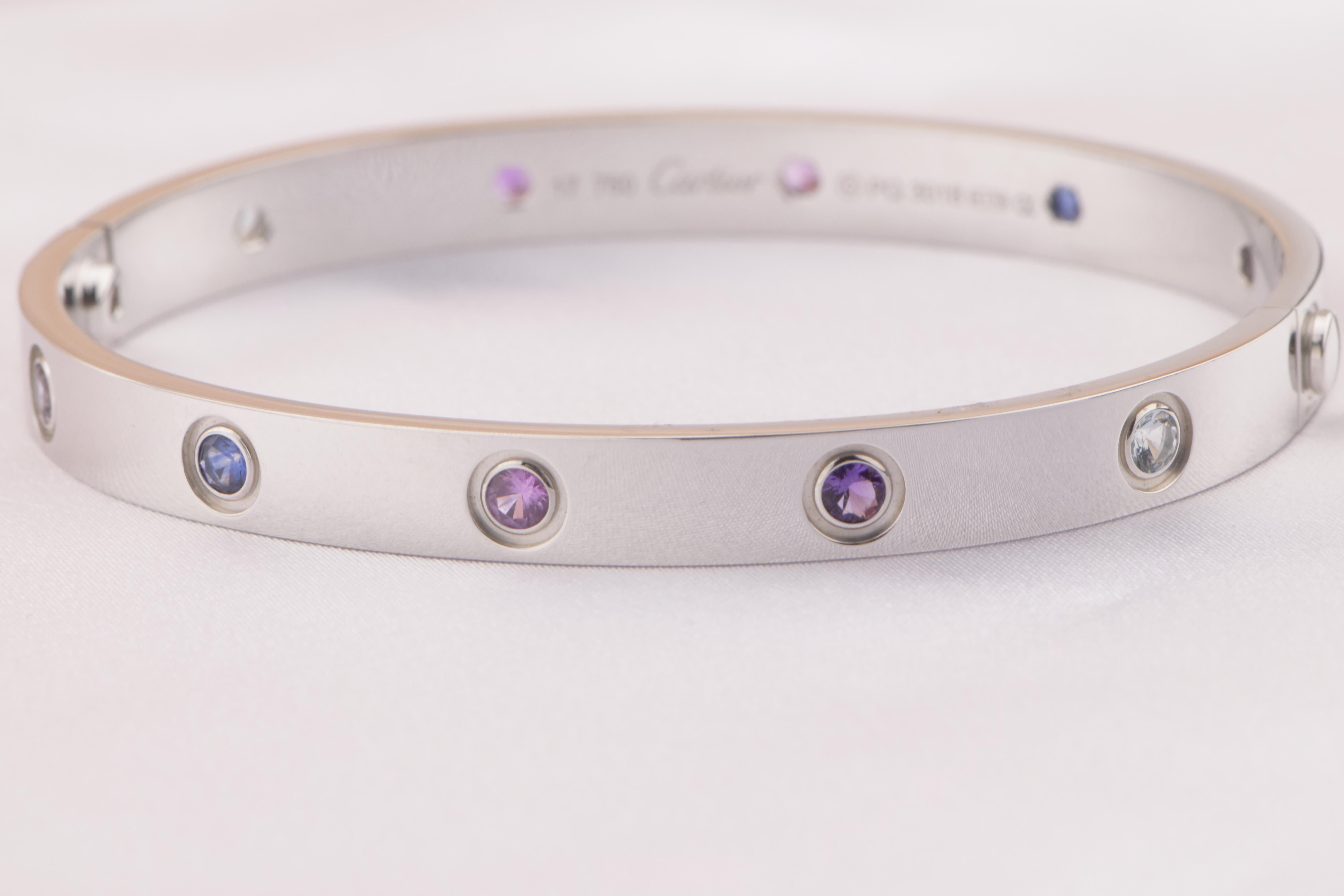 LOVE bracelet, 18K white gold, set with 2 aquamarines, 2 pink sapphires, 2 blue sapphires, 2 purple spinels, and 2 amethysts. Size 16
____________________________________________________

Dandelion Antiques Code:  AT-0976
Brand:  Cartier
Model: 