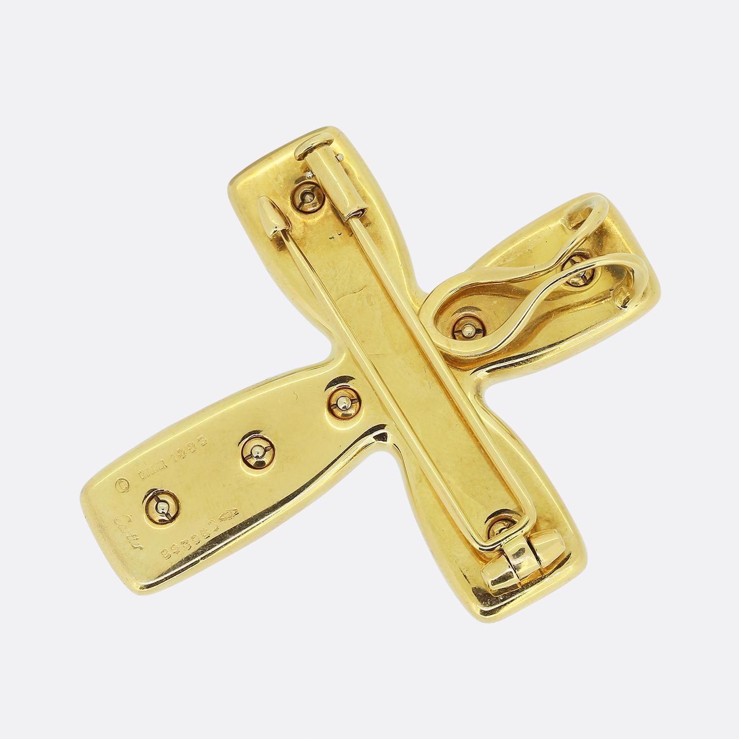 Here we have a stunning piece from the world renowned luxury jewellery house of Cartier. This chic brooch/pendant has been crafted from a rich 18ct yellow gold into the shape of a Byzantine cross and decorated with a vast array of colourful
