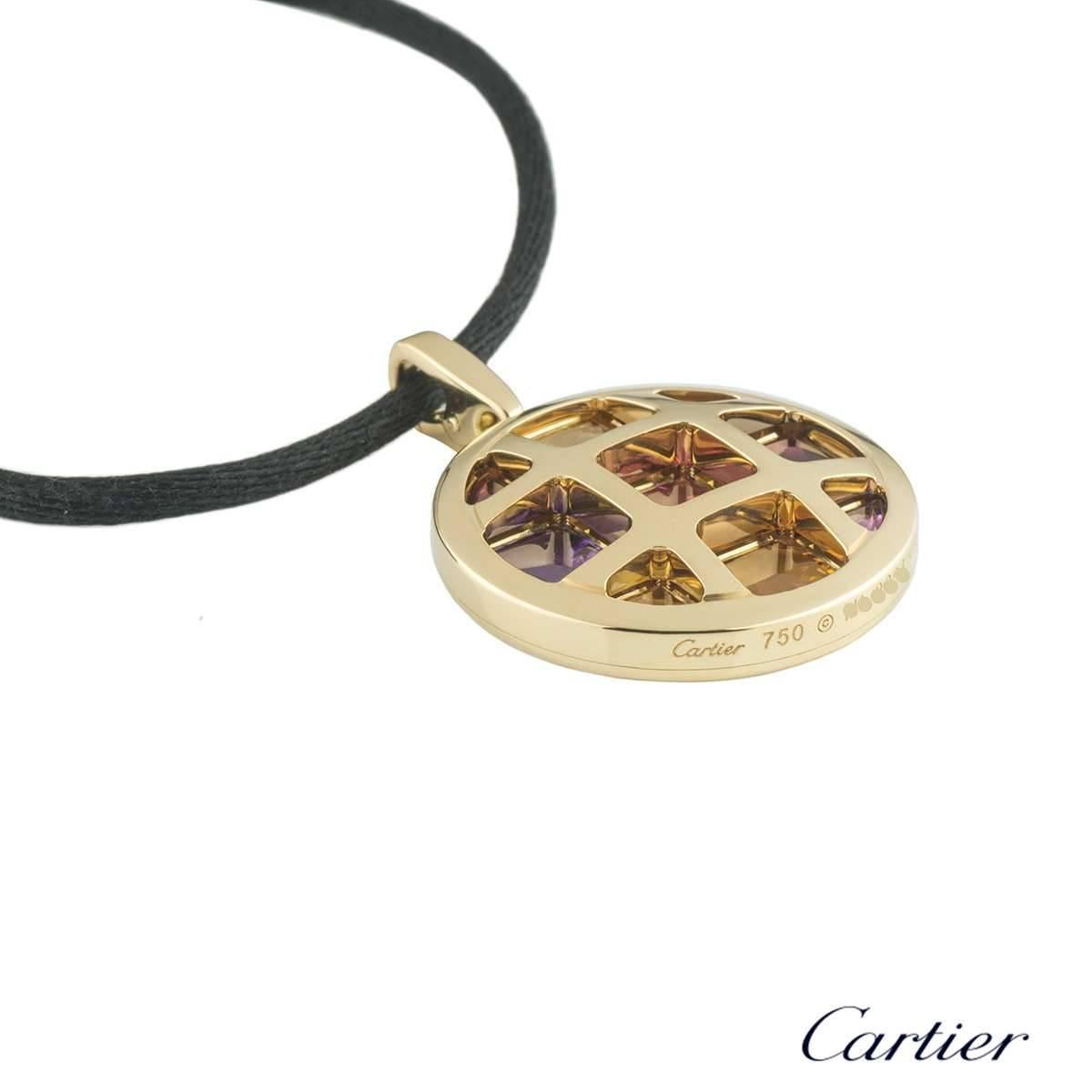 A gorgeous 18k yellow gold Cartier necklace from the Pasha collection. The necklace features a circular motif with the iconic square grid design, accentuated by multi-gemstones set evenly between the grid. The gemstones include tourmaline, amethyst