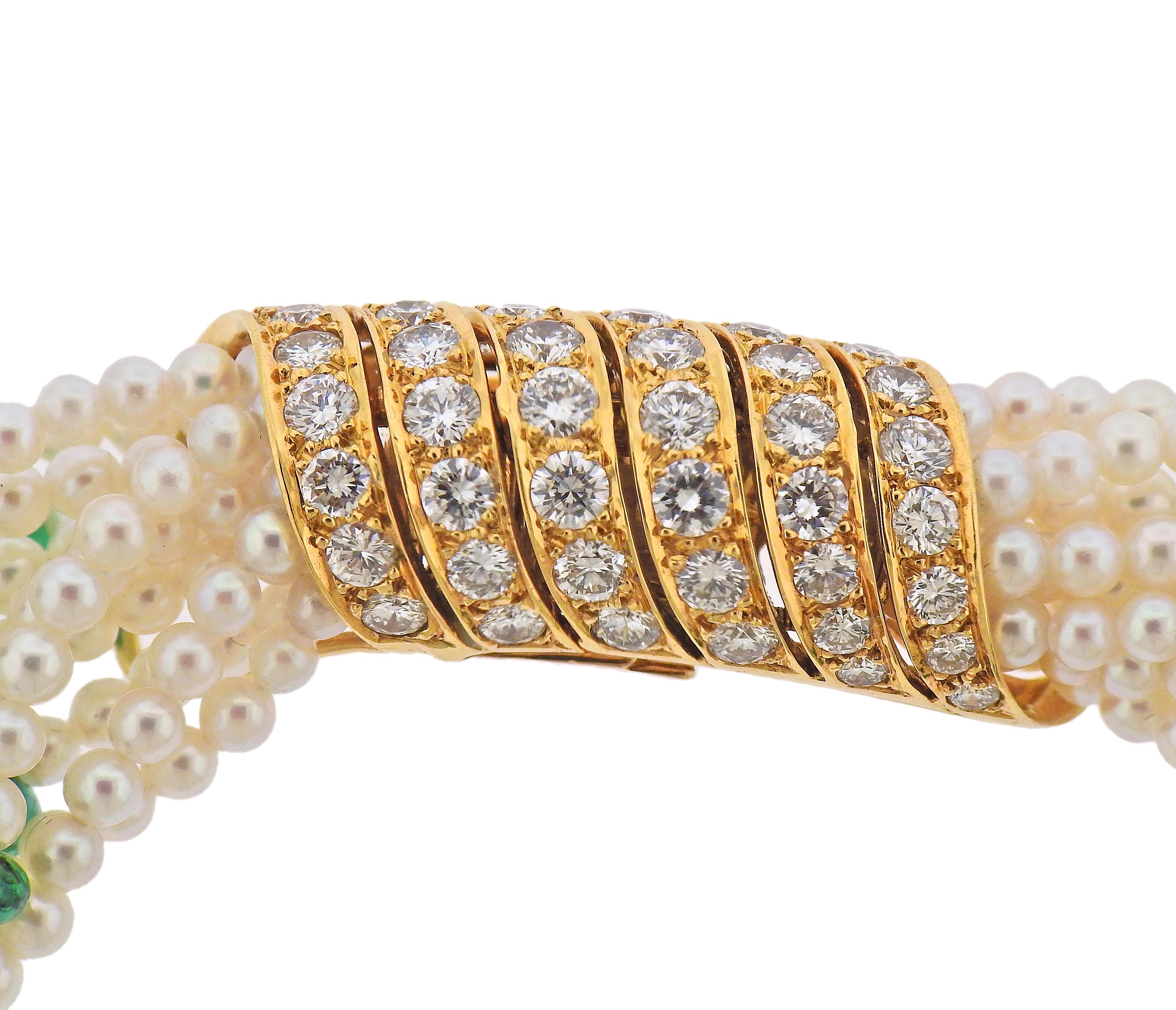 18k yellow gold multi strand Cartier bracelet, set with 4mm to 6mm emerald cabochons, 3mm to 3.5mm pearls and approx. 4.00 carats in diamonds. Bracelet is 8