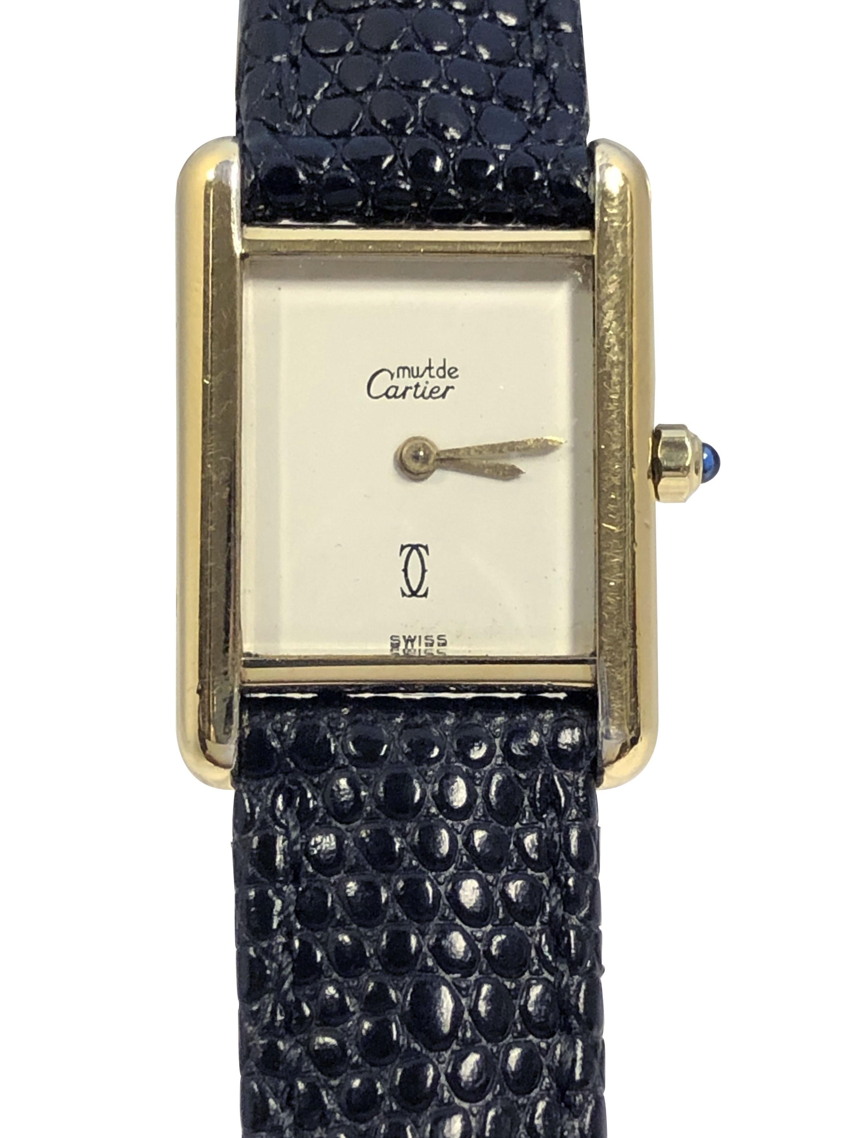 Circa 1990 Cartier, Must ds Cartier Classic Tank Wrist Watch, 28 X 20 M.M. 2 Piece Vermeil ( Gold plate on Sterling silver ) Case. Quartz movement, Rare and hard to find White dial with Gold hands, Sapphire set crown. New Black Lizard Grain Strap 