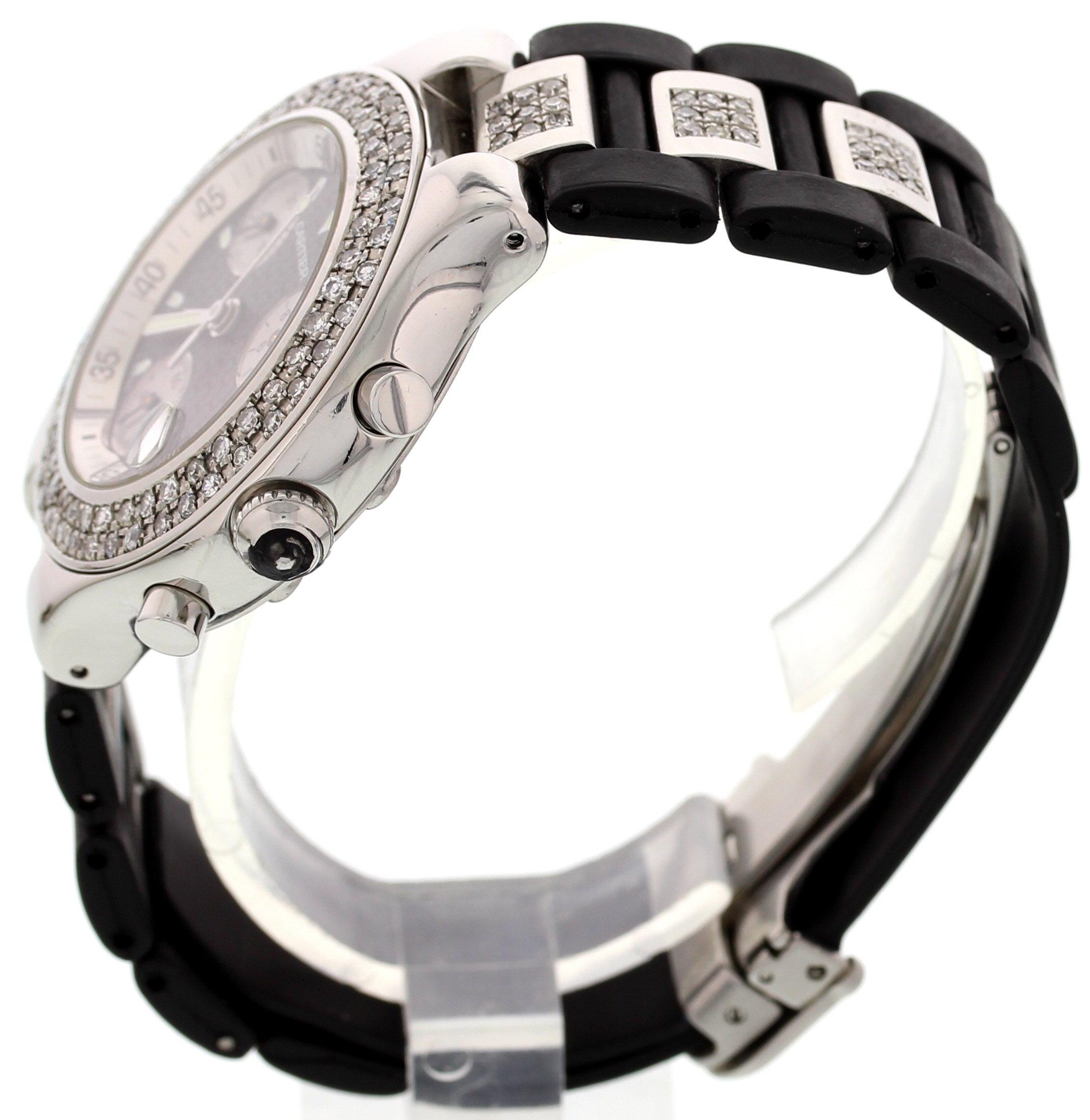 Men's Cartier Must 21 Chronoscaph watch. 38 mm stainless steel case. Custom set diamond bezel. Black dial with a Cartier logo pattern. Luminous hands & markers, and a magnified date display. Black rubber band with stainless steel and diamonds with a
