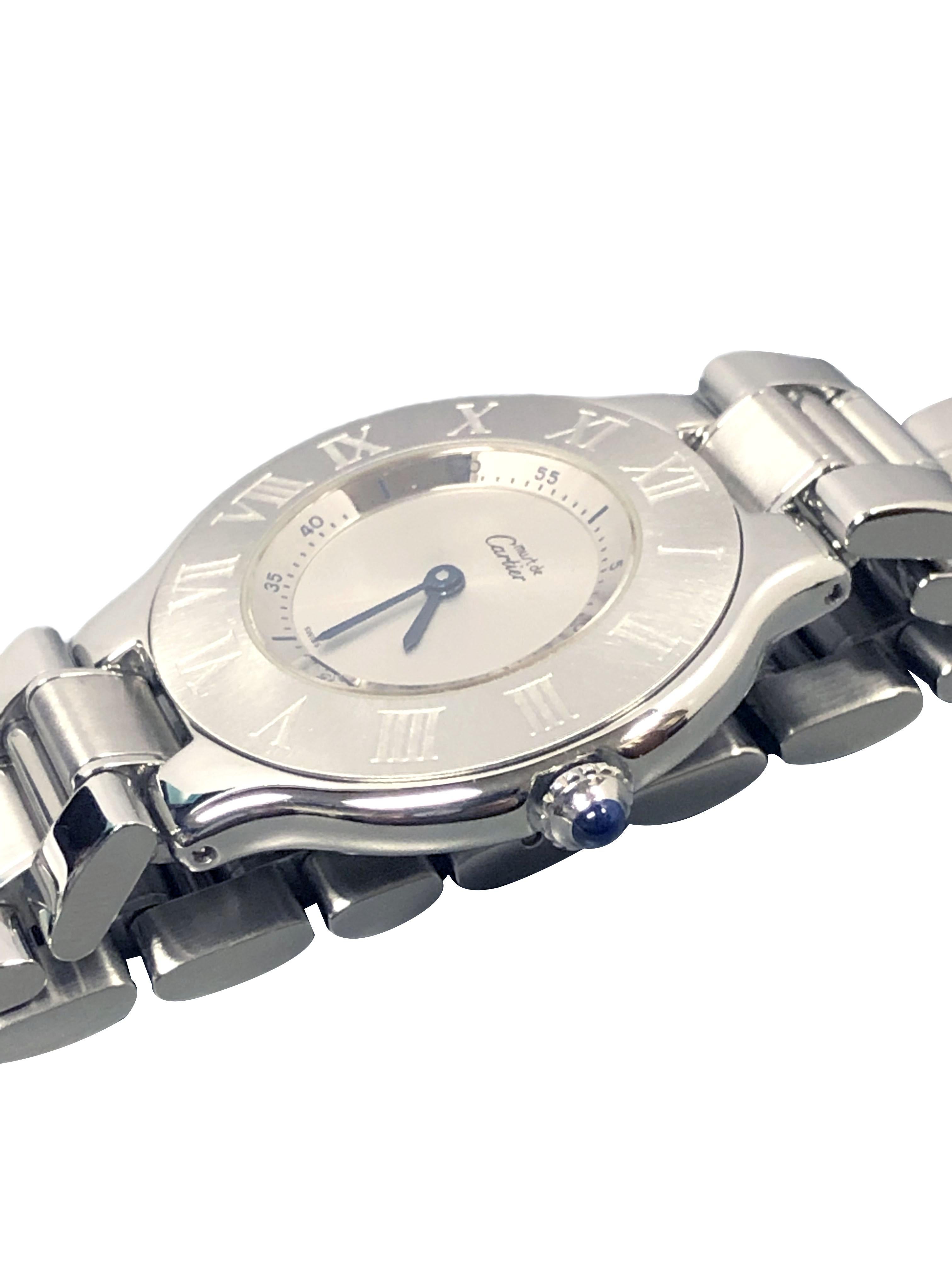 Circa 2000 Cartier Must 21 Reference 1330 mid size Wrist Watch, 31 M.M. Stainless Steel Water Resistant case, Quartz Movement, Silver Dial, Roman Numeral Bezel, Sapphire Crown. 1/2 inch wide Stainless Steel bracelet with fold over Deployment clasp.